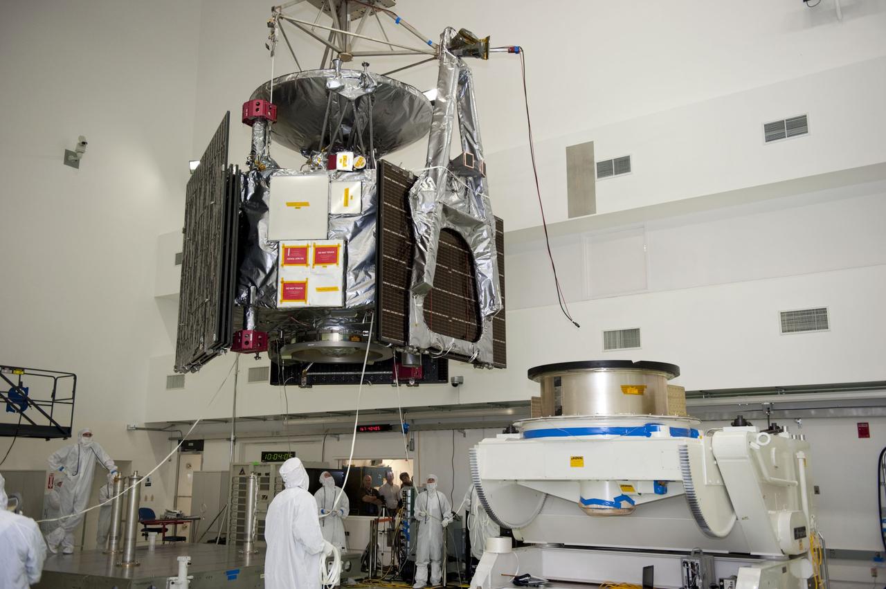 CAPE CANAVERAL, Fla. -- Technicians at Astrotech's payload processing facility in Titusville, Fla. monitor NASA's Juno spacecraft as it is moved by an overhead crane to a rotation stand for center of gravity, weighing and balancing testing.      Juno is scheduled to launch aboard United Launch Alliance Atlas V rocket from Cape Canaveral, Fla. Aug. 5.The solar-powered spacecraft will orbit Jupiter's poles 33 times to find out more about the gas giant's origins, structure, atmosphere and magnetosphere and investigate the existence of a solid planetary core. For more information visit: www.nasa.gov/juno. Photo credit: NASA/Kim Shiflett
