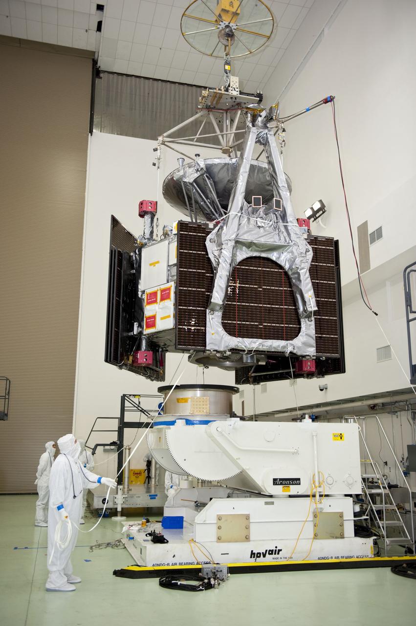 Technicians at Astrotech's payload processing facility in Titusville, Fla. monitor NASA's Juno spacecraft, as it is lifted by an overhead crane, for its move to a rotation stand for center of gravity, weighing and balancing testing. Juno is scheduled to launch aboard United Launch Alliance Atlas V rocket from Cape Canaveral, Fla. Aug. 5.The solar-powered spacecraft will orbit Jupiter's poles 33 times to find out more about the gas giant's origins, structure, atmosphere and magnetosphere and investigate the existence of a solid planetary core. For more information visit: www.nasa.gov/juno. Photo credit: NASA/Kim Shiflett