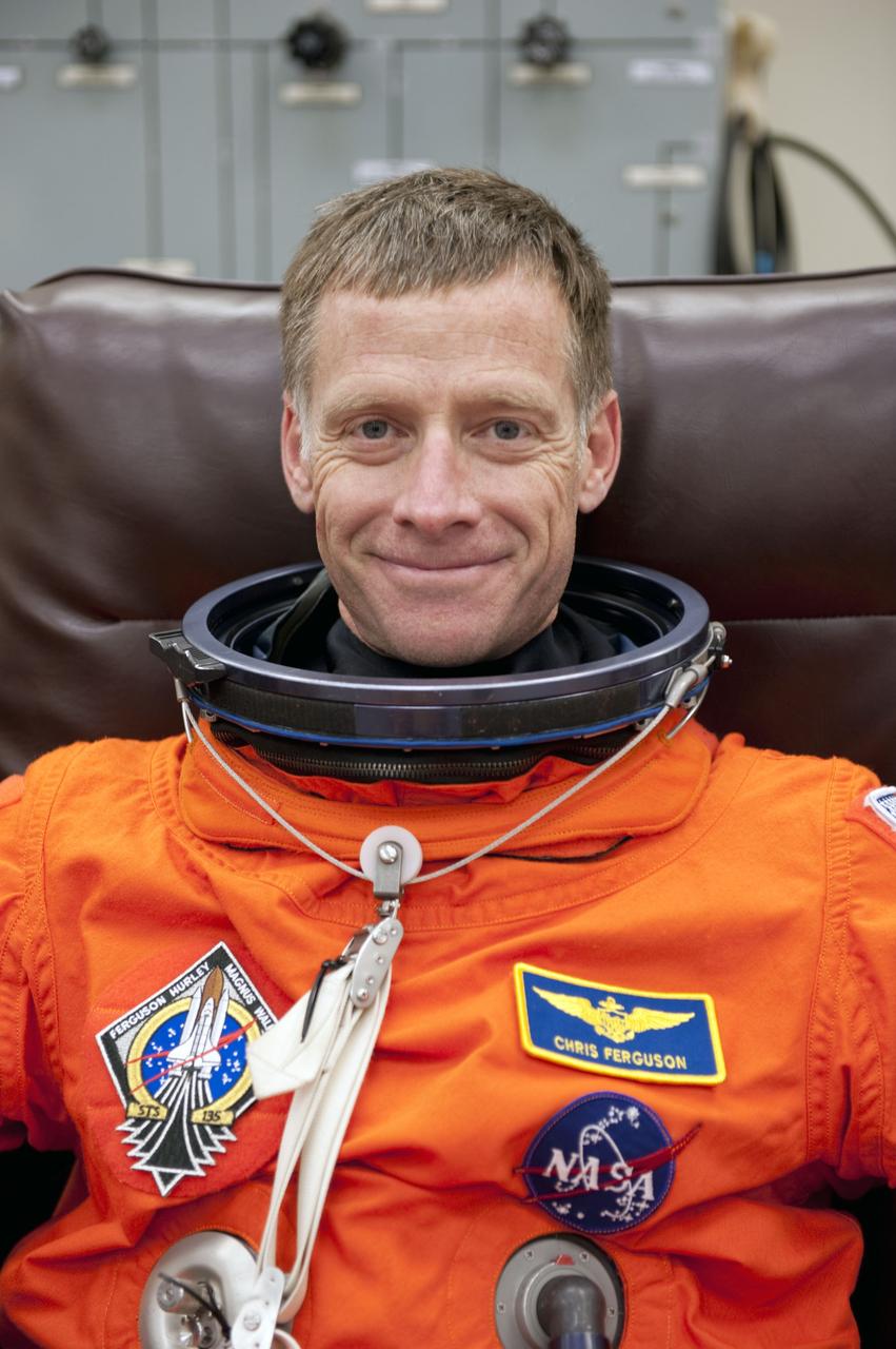 CAPE CANAVERAL, Fla. -- In the Operations and Checkout Building at NASA's Kennedy Space Center in Florida, Commander Chris Ferguson checks the fit of his launch and landing suit. The STS-135 crew is at Kennedy to participate in a launch countdown dress rehearsal called the Terminal Countdown Demonstration Test (TCDT) and related training in preparation for the upcoming STS-135 mission.            Atlantis and its crew are targeted to lift off July 8, taking with them the Raffaello multi-purpose logistics module packed with supplies and spare parts to the International Space Station. The STS-135 mission also will fly a system to investigate the potential for robotically refueling existing satellites and return a failed ammonia pump module to help NASA better understand the failure mechanism and improve pump designs for future systems. STS-135 will be the 33rd flight of Atlantis, the 37th shuttle mission to the space station, and the 135th and final mission of NASA's Space Shuttle Program. For more information visit, www.nasa.gov/mission_pages/shuttle/shuttlemissions/sts135/index.html.  Photo credit: NASA/Kim Shiflett