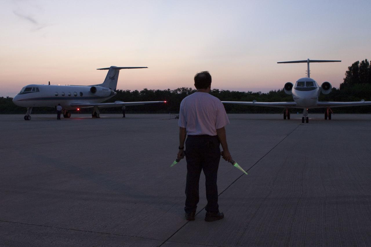 CAPE CANAVERAL, Fla. -- STS-135 Commander Chris Ferguson and Pilot Doug Hurley are signaled for takeoff from the Shuttle Landing Facility runway at NASA's Kennedy Space Center in Florida to perform touch-and-go landings aboard their Shuttle Training Aircrafts (STA). An STA is a Gulfstream II jet that is modified to mimic the shuttle's handling during the final phase of landing. Ferguson and Hurley will practice landings as part of standard training before space shuttle Atlantis' launch to the International Space Station. Atlantis and its crew are targeted to lift off July 8, to deliver the Raffaello multi-purpose logistics module packed with supplies and spare parts to the station. The STS-135 mission also will fly a system to investigate the potential for robotically refueling existing satellites and return a failed ammonia pump module to help NASA better understand the failure mechanism and improve pump designs for future systems. STS-135 will be the 33rd flight of Atlantis, the 37th shuttle mission to the space station, and the 135th and final mission of NASA's Space Shuttle Program. For more information visit, www.nasa.gov/mission_pages/shuttle/shuttlemissions/sts135/index.html. Photo credit: NASA/Troy Cryder