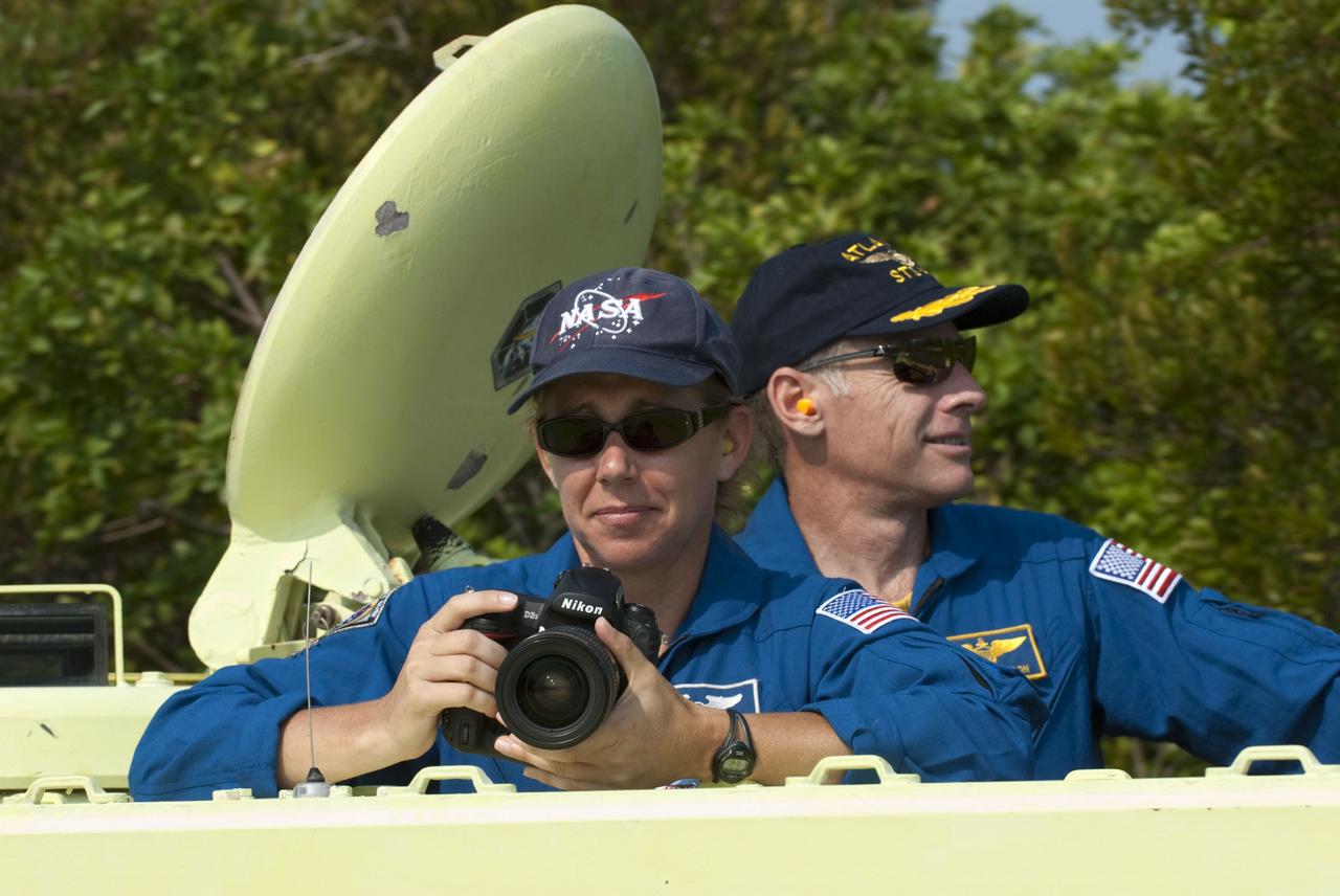 CAPE CANAVERAL, Fla. -- Space shuttle Atlantis' STS-135 crew members participate in M113 armored personnel carrier training at NASA's Kennedy Space Center in Florida. Seen here are Mission Specialist Sandy Magnus (left) and Commander Chris Ferguson. An M113 is kept at the foot of the launch pad in case an emergency exit from the launch pad is needed and every shuttle crew is trained on driving the vehicle before launch. The crew is at Kennedy to participate in a launch countdown dress rehearsal called the Terminal Countdown Demonstration Test (TCDT) and related training. Atlantis and its crew are targeted to lift off July 8, taking with them the Raffaello multi-purpose logistics module packed with supplies and spare parts to the International Space Station. The STS-135 mission also will fly a system to investigate the potential for robotically refueling existing satellites and return a failed ammonia pump module to help NASA better understand the failure mechanism and improve pump designs for future systems. STS-135 will be the 33rd flight of Atlantis, the 37th shuttle mission to the space station, and the 135th and final mission of NASA's Space Shuttle Program. For more information visit, www.nasa.gov/mission_pages/shuttle/shuttlemissions/sts135/index.html. Photo credit: NASA/Kim Shiflett
