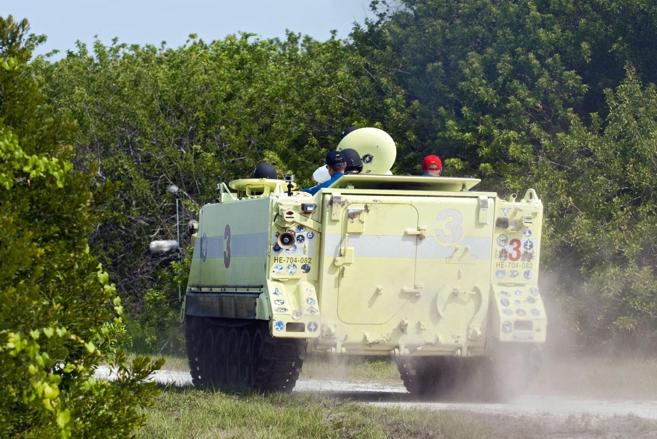 CAPE CANAVERAL, Fla. -- Space shuttle Atlantis' STS-135 crew members participate in M113 armored personnel carrier training at NASA's Kennedy Space Center in Florida. An M113 is kept at the foot of the launch pad in case an emergency exit from the launch pad is needed and every shuttle crew is trained on driving the vehicle before launch. The crew is at Kennedy to participate in a launch countdown dress rehearsal called the Terminal Countdown Demonstration Test (TCDT) and related training. Atlantis and its crew are targeted to lift off July 8, taking with them the Raffaello multi-purpose logistics module packed with supplies and spare parts to the International Space Station. The STS-135 mission also will fly a system to investigate the potential for robotically refueling existing satellites and return a failed ammonia pump module to help NASA better understand the failure mechanism and improve pump designs for future systems. STS-135 will be the 33rd flight of Atlantis, the 37th shuttle mission to the space station, and the 135th and final mission of NASA's Space Shuttle Program. For more information visit, www.nasa.gov/mission_pages/shuttle/shuttlemissions/sts135/index.html. Photo credit: NASA/Kim Shiflett