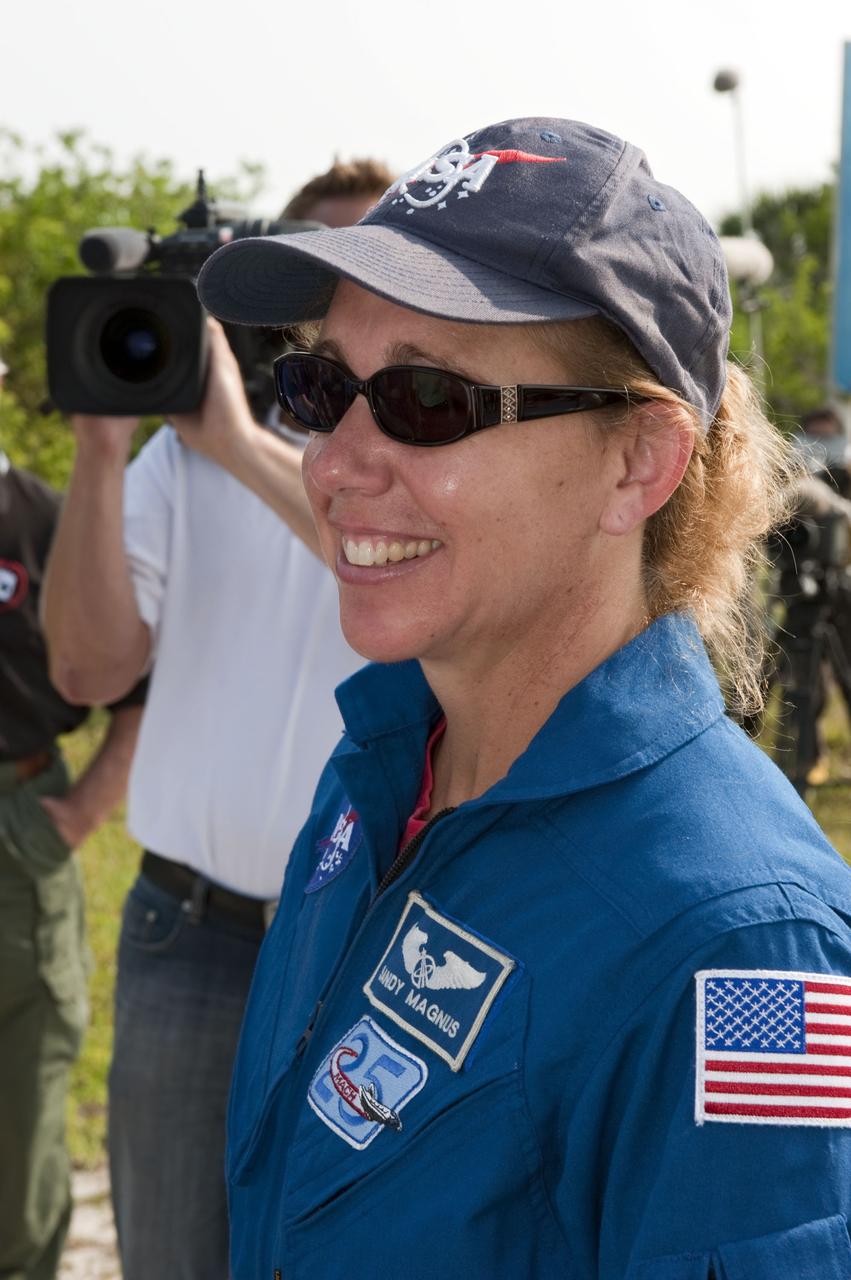 CAPE CANAVERAL, Fla. -- Mission Specialist Sandy Magnus pauses for a photo during M113 armored personnel carrier training at NASA's Kennedy Space Center in Florida. An M113 is kept at the foot of the launch pad in case an emergency exit from the launch pad is needed and every shuttle crew is trained on driving the vehicle before launch. The STS-135 crew is at Kennedy to participate in a launch countdown dress rehearsal called the Terminal Countdown Demonstration Test (TCDT) and related training. Atlantis and its crew are targeted to lift off July 8, taking with them the Raffaello multi-purpose logistics module packed with supplies and spare parts to the International Space Station. The STS-135 mission also will fly a system to investigate the potential for robotically refueling existing satellites and return a failed ammonia pump module to help NASA better understand the failure mechanism and improve pump designs for future systems. STS-135 will be the 33rd flight of Atlantis, the 37th shuttle mission to the space station, and the 135th and final mission of NASA's Space Shuttle Program. For more information visit, www.nasa.gov/mission_pages/shuttle/shuttlemissions/sts135/index.html. Photo credit: NASA/Kim Shiflett