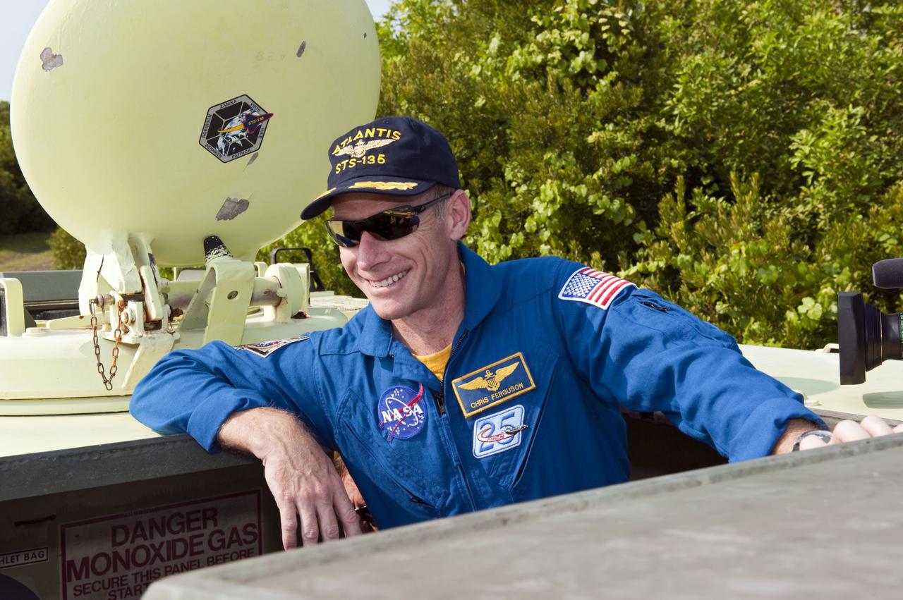 CAPE CANAVERAL, Fla. -- Commander Chris Ferguson pauses for a photo during M113 armored personnel carrier training at NASA's Kennedy Space Center in Florida. An M113 is kept at the foot of the launch pad in case an emergency exit from the launch pad is needed and every shuttle crew is trained on driving the vehicle before launch. The STS-135 crew is at Kennedy to participate in a launch countdown dress rehearsal called the Terminal Countdown Demonstration Test (TCDT) and related training. Atlantis and its crew are targeted to lift off July 8, taking with them the Raffaello multi-purpose logistics module packed with supplies and spare parts to the International Space Station. The STS-135 mission also will fly a system to investigate the potential for robotically refueling existing satellites and return a failed ammonia pump module to help NASA better understand the failure mechanism and improve pump designs for future systems. STS-135 will be the 33rd flight of Atlantis, the 37th shuttle mission to the space station, and the 135th and final mission of NASA's Space Shuttle Program. For more information visit, www.nasa.gov/mission_pages/shuttle/shuttlemissions/sts135/index.html. Photo credit: NASA/Kim Shiflett