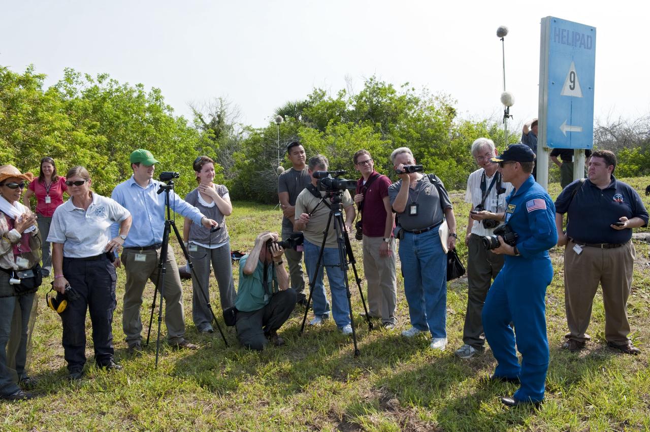 CAPE CANAVERAL, Fla. -- Commander Chris Ferguson speaks with media at the conclusion of the crew's M113 armored personnel carrier training at NASA's Kennedy Space Center in Florida. An M113 is kept at the foot of the launch pad in case an emergency exit from the launch pad is needed and every shuttle crew is trained on driving the vehicle before launch. The STS-135 crew is at Kennedy to participate in a launch countdown dress rehearsal called the Terminal Countdown Demonstration Test (TCDT) and related training. Atlantis and its crew are targeted to lift off July 8, taking with them the Raffaello multi-purpose logistics module packed with supplies and spare parts to the International Space Station. The STS-135 mission also will fly a system to investigate the potential for robotically refueling existing satellites and return a failed ammonia pump module to help NASA better understand the failure mechanism and improve pump designs for future systems. STS-135 will be the 33rd flight of Atlantis, the 37th shuttle mission to the space station, and the 135th and final mission of NASA's Space Shuttle Program. For more information visit, www.nasa.gov/mission_pages/shuttle/shuttlemissions/sts135/index.html. Photo credit: NASA/Kim Shiflett