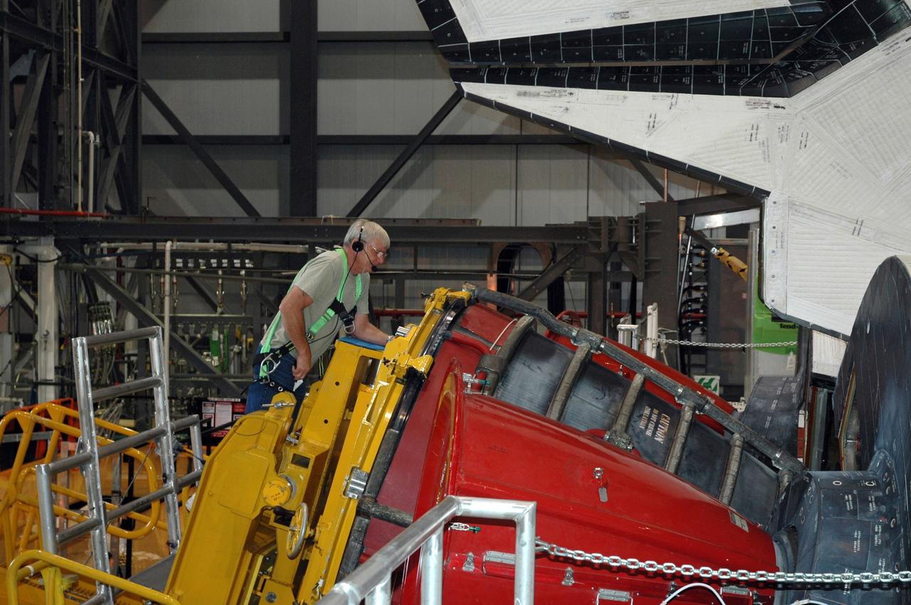 CAPE CANAVERAL, Fla. -- In Orbiter Processing Facility-1 at NASA's Kennedy Space Center in Florida, technicians remove engine No. 1, one of three space shuttle main engines from shuttle Endeavour using a specially designed engine installer, called a Hyster forklift.          The work is part of Endeavour's transition and retirement processing. The spacecraft is being prepared for public display at the California Science Center in Los Angeles. Endeavour flew 25 missions, spent 299 days in space, orbited Earth 4,671 times and traveled 122,883,151 miles over the course of its 19-year career. Endeavour's STS-134 and final mission was completed after landing on June 1, 2011. Photo credit: NASA/Chris Chamberland