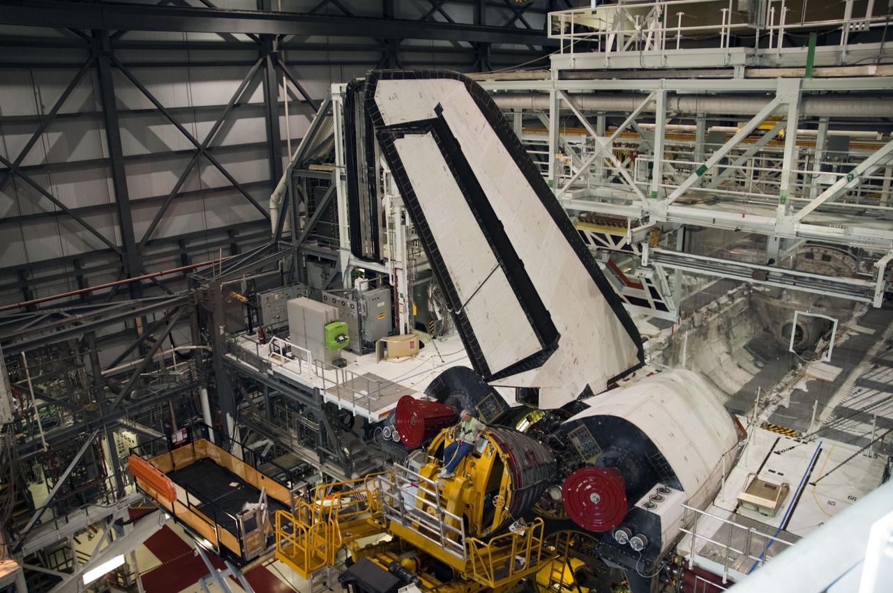 CAPE CANAVERAL, Fla. -- In Orbiter Processing Facility-1 at NASA's Kennedy Space Center in Florida, technicians remove engine No. 1, one of three space shuttle main engines from shuttle Endeavour using a specially designed engine installer, called a Hyster forklift.          The work is part of Endeavour's transition and retirement processing. The spacecraft is being prepared for public display at the California Science Center in Los Angeles. Endeavour flew 25 missions, spent 299 days in space, orbited Earth 4,671 times and traveled 122,883,151 miles over the course of its 19-year career. Endeavour's STS-134 and final mission was completed after landing on June 1, 2011. Photo credit: NASA/Chris Chamberland