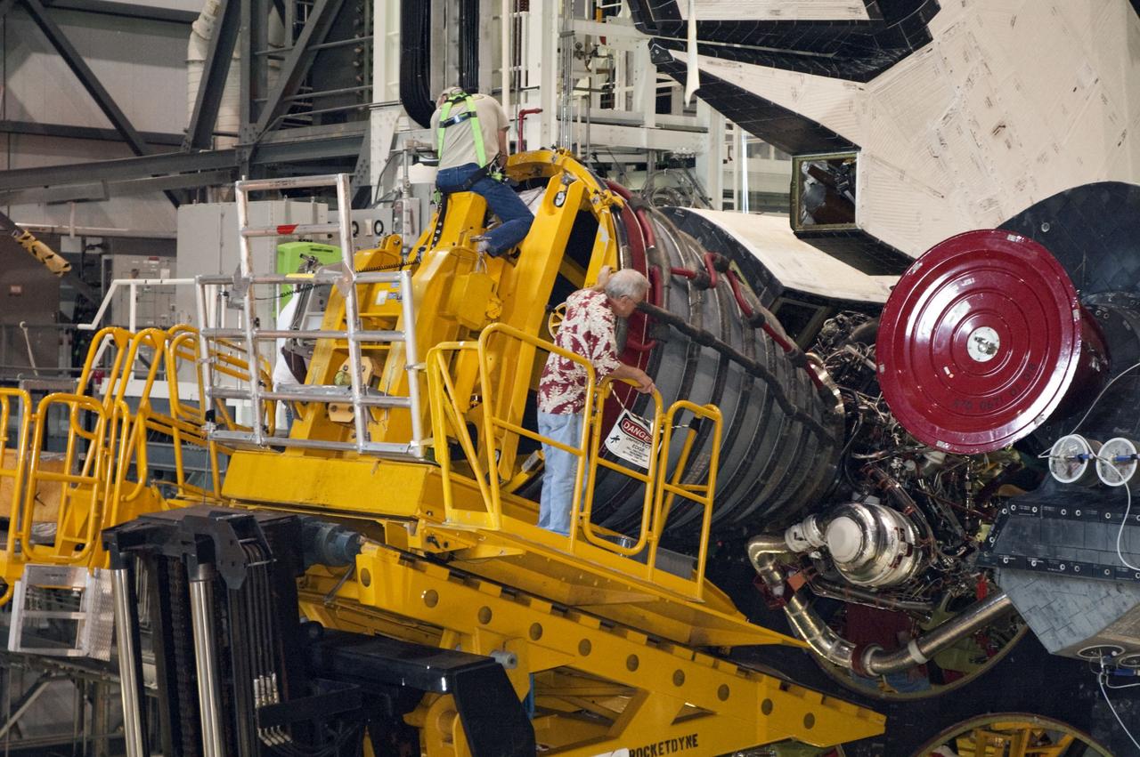 CAPE CANAVERAL, Fla. -- In Orbiter Processing Facility-1 at NASA's Kennedy Space Center in Florida, technicians remove engine No. 1, one of three space shuttle main engines from shuttle Endeavour using a specially designed engine installer, called a Hyster forklift.          The work is part of Endeavour's transition and retirement processing. The spacecraft is being prepared for public display at the California Science Center in Los Angeles. Endeavour flew 25 missions, spent 299 days in space, orbited Earth 4,671 times and traveled 122,883,151 miles over the course of its 19-year career. Endeavour's STS-134 and final mission was completed after landing on June 1, 2011. Photo credit: NASA/Chris Chamberland