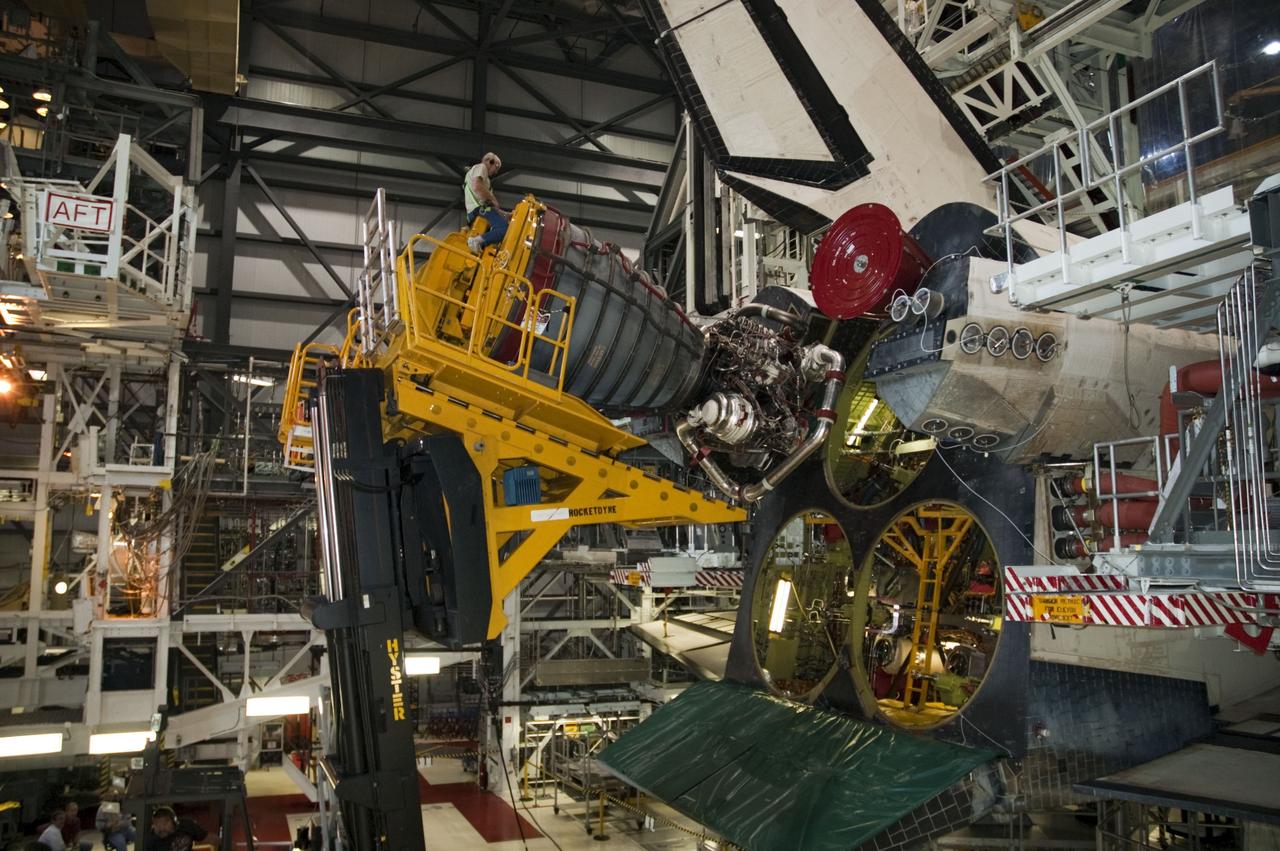 CAPE CANAVERAL, Fla. -- In Orbiter Processing Facility-1 at NASA's Kennedy Space Center in Florida, technicians remove engine No. 1, one of three space shuttle main engines from shuttle Endeavour using a specially designed engine installer, called a Hyster forklift.          The work is part of Endeavour's transition and retirement processing. The spacecraft is being prepared for public display at the California Science Center in Los Angeles. Endeavour flew 25 missions, spent 299 days in space, orbited Earth 4,671 times and traveled 122,883,151 miles over the course of its 19-year career. Endeavour's STS-134 and final mission was completed after landing on June 1, 2011. Photo credit: NASA/Chris Chamberland