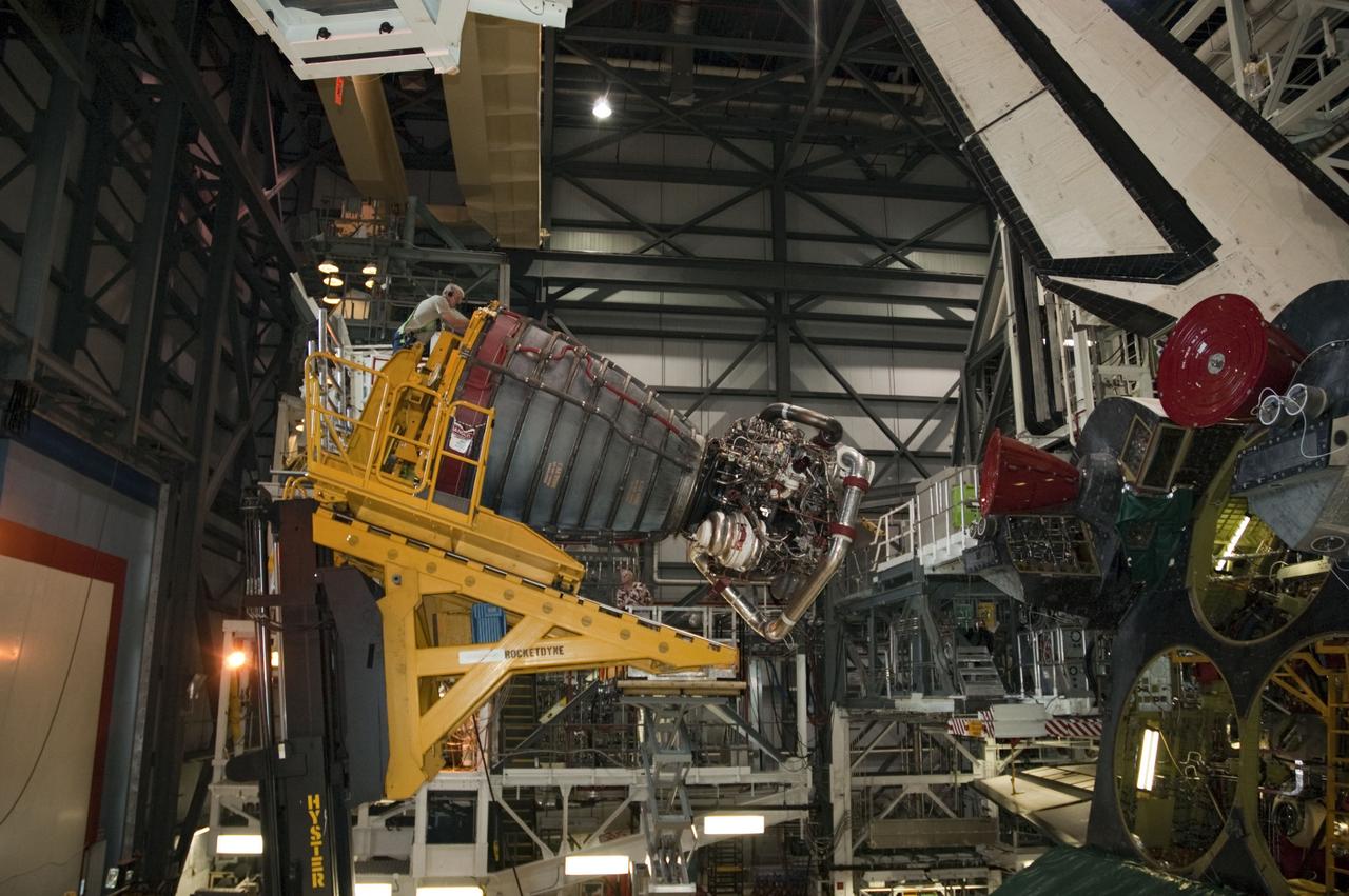 CAPE CANAVERAL, Fla. -- In Orbiter Processing Facility-1 at NASA's Kennedy Space Center in Florida, technicians remove engine No. 1, one of three space shuttle main engines from shuttle Endeavour using a specially designed engine installer, called a Hyster forklift.          The work is part of Endeavour's transition and retirement processing. The spacecraft is being prepared for public display at the California Science Center in Los Angeles. Endeavour flew 25 missions, spent 299 days in space, orbited Earth 4,671 times and traveled 122,883,151 miles over the course of its 19-year career. Endeavour's STS-134 and final mission was completed after landing on June 1, 2011. Photo credit: NASA/Chris Chamberland