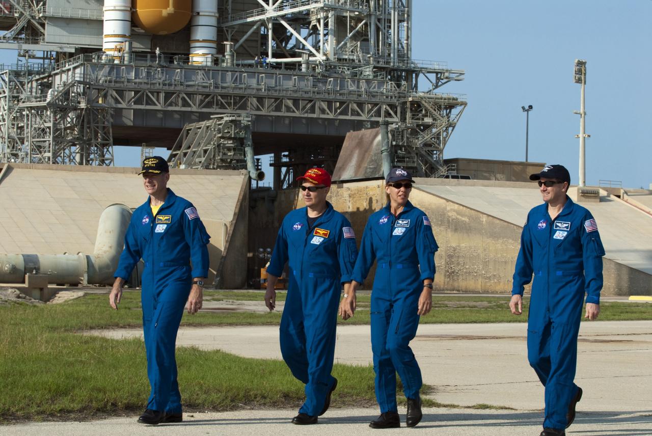 CAPE CANAVERAL, Fla. -- The STS-135 crew members gather at NASA Kennedy Space Center's Launch Pad 39A in Florida for a question-and-answer session with media. From left are Commander Chris Ferguson, Pilot Doug Hurley, Mission Specialists Sandy Magnus and Rex Walheim. Space shuttle Atlantis' astronauts are at Kennedy to participate in a launch countdown dress rehearsal called the Terminal Countdown Demonstration Test (TCDT) and related training.              Atlantis and its crew are targeted to lift off July 8, taking with them the Raffaello multi-purpose logistics module packed with supplies and spare parts to the International Space Station. The STS-135 mission also will fly a system to investigate the potential for robotically refueling existing satellites and return a failed ammonia pump module to help NASA better understand the failure mechanism and improve pump designs for future systems. STS-135 will be the 33rd flight of Atlantis, the 37th shuttle mission to the space station, and the 135th and final mission of NASA's Space Shuttle Program. For more information visit, www.nasa.gov/mission_pages/shuttle/shuttlemissions/sts135/index.html. Photo credit: NASA/Kim Shiflett