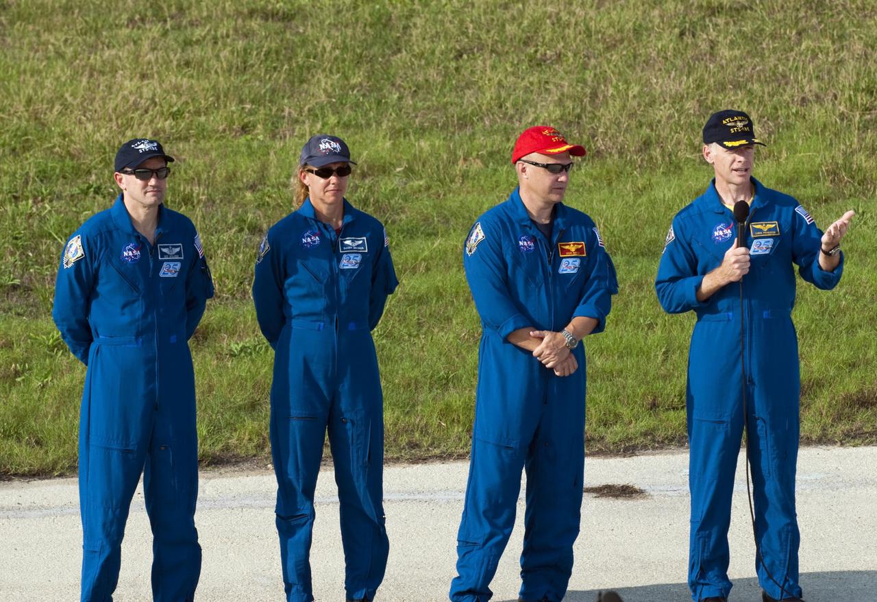 CAPE CANAVERAL, Fla. -- The STS-135 crew members gather at NASA Kennedy Space Center's Launch Pad 39A in Florida for a question-and-answer session with media. With the microphone in hand is Commander Chris Ferguson as Pilot Doug Hurley, Mission Specialists Sandy Magnus and Rex Walheim look on. Space shuttle Atlantis' astronauts are at Kennedy to participate in a launch countdown dress rehearsal called the Terminal Countdown Demonstration Test (TCDT) and related training.                Atlantis and its crew are targeted to lift off July 8, taking with them the Raffaello multi-purpose logistics module packed with supplies and spare parts to the International Space Station. The STS-135 mission also will fly a system to investigate the potential for robotically refueling existing satellites and return a failed ammonia pump module to help NASA better understand the failure mechanism and improve pump designs for future systems. STS-135 will be the 33rd flight of Atlantis, the 37th shuttle mission to the space station, and the 135th and final mission of NASA's Space Shuttle Program. For more information visit, www.nasa.gov/mission_pages/shuttle/shuttlemissions/sts135/index.html. Photo credit: NASA/Kim Shiflett