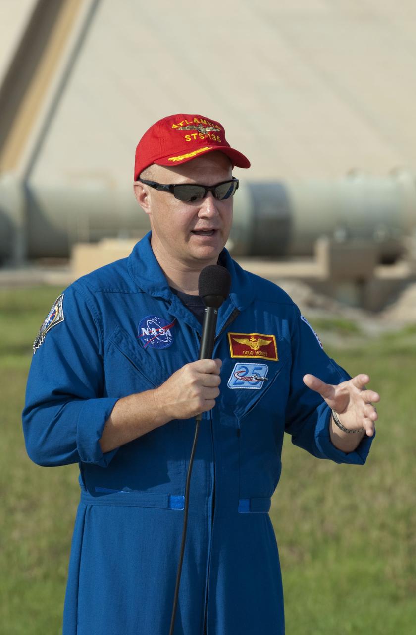 CAPE CANAVERAL, Fla. -- STS-135 Pilot Doug Hurley speaks to media during a question-and-answer session at NASA Kennedy Space Center's Launch Pad 39A in Florida. Space shuttle Atlantis' astronauts are at Kennedy to participate in a launch countdown dress rehearsal called the Terminal Countdown Demonstration Test (TCDT) and related training.              Atlantis and its crew are targeted to lift off July 8, taking with them the Raffaello multi-purpose logistics module packed with supplies and spare parts to the International Space Station. The STS-135 mission also will fly a system to investigate the potential for robotically refueling existing satellites and return a failed ammonia pump module to help NASA better understand the failure mechanism and improve pump designs for future systems. STS-135 will be the 33rd flight of Atlantis, the 37th shuttle mission to the space station, and the 135th and final mission of NASA's Space Shuttle Program. For more information visit, www.nasa.gov/mission_pages/shuttle/shuttlemissions/sts135/index.html. Photo credit: NASA/Kim Shiflett