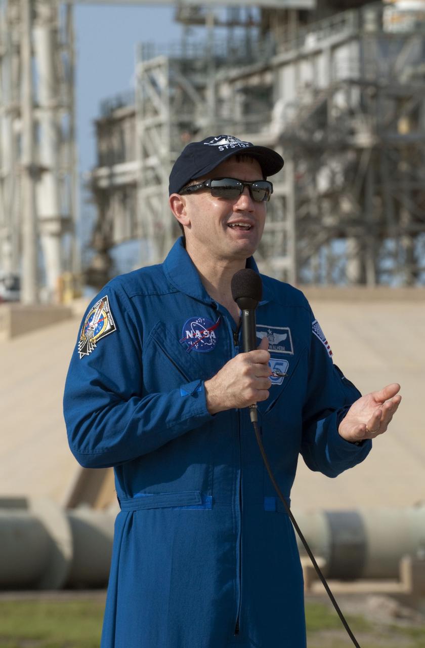 CAPE CANAVERAL, Fla. -- STS-135 Mission Specialist Rex Walheim speaks to media during a question-and-answer session at NASA Kennedy Space Center's Launch Pad 39A in Florida. Space shuttle Atlantis' astronauts are at Kennedy to participate in a launch countdown dress rehearsal called the Terminal Countdown Demonstration Test (TCDT) and related training.            Atlantis and its crew are targeted to lift off July 8, taking with them the Raffaello multi-purpose logistics module packed with supplies and spare parts to the International Space Station. The STS-135 mission also will fly a system to investigate the potential for robotically refueling existing satellites and return a failed ammonia pump module to help NASA better understand the failure mechanism and improve pump designs for future systems. STS-135 will be the 33rd flight of Atlantis, the 37th shuttle mission to the space station, and the 135th and final mission of NASA's Space Shuttle Program. For more information visit, www.nasa.gov/mission_pages/shuttle/shuttlemissions/sts135/index.html. Photo credit: NASA/Kim Shiflett