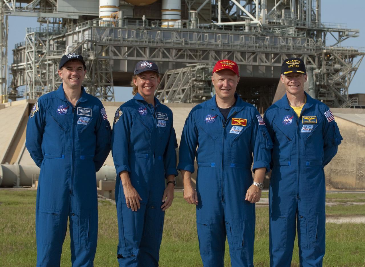 CAPE CANAVERAL, Fla. -- The STS-135 crew members stand for a photograph after a question-and-answer session with media at NASA Kennedy Space Center's Launch Pad 39A in Florida. From left are Mission Specialists Rex Walheim and Sandy Magnus; Pilot Doug Hurley and Commander Chris Ferguson. Space shuttle Atlantis' astronauts are at Kennedy to participate in a launch countdown dress rehearsal called the Terminal Countdown Demonstration Test (TCDT) and related training.          Atlantis and its crew are targeted to lift off July 8, taking with them the Raffaello multi-purpose logistics module packed with supplies and spare parts to the International Space Station. The STS-135 mission also will fly a system to investigate the potential for robotically refueling existing satellites and return a failed ammonia pump module to help NASA better understand the failure mechanism and improve pump designs for future systems. STS-135 will be the 33rd flight of Atlantis, the 37th shuttle mission to the space station, and the 135th and final mission of NASA's Space Shuttle Program. For more information visit, www.nasa.gov/mission_pages/shuttle/shuttlemissions/sts135/index.html. Photo credit: NASA/Kim Shiflett