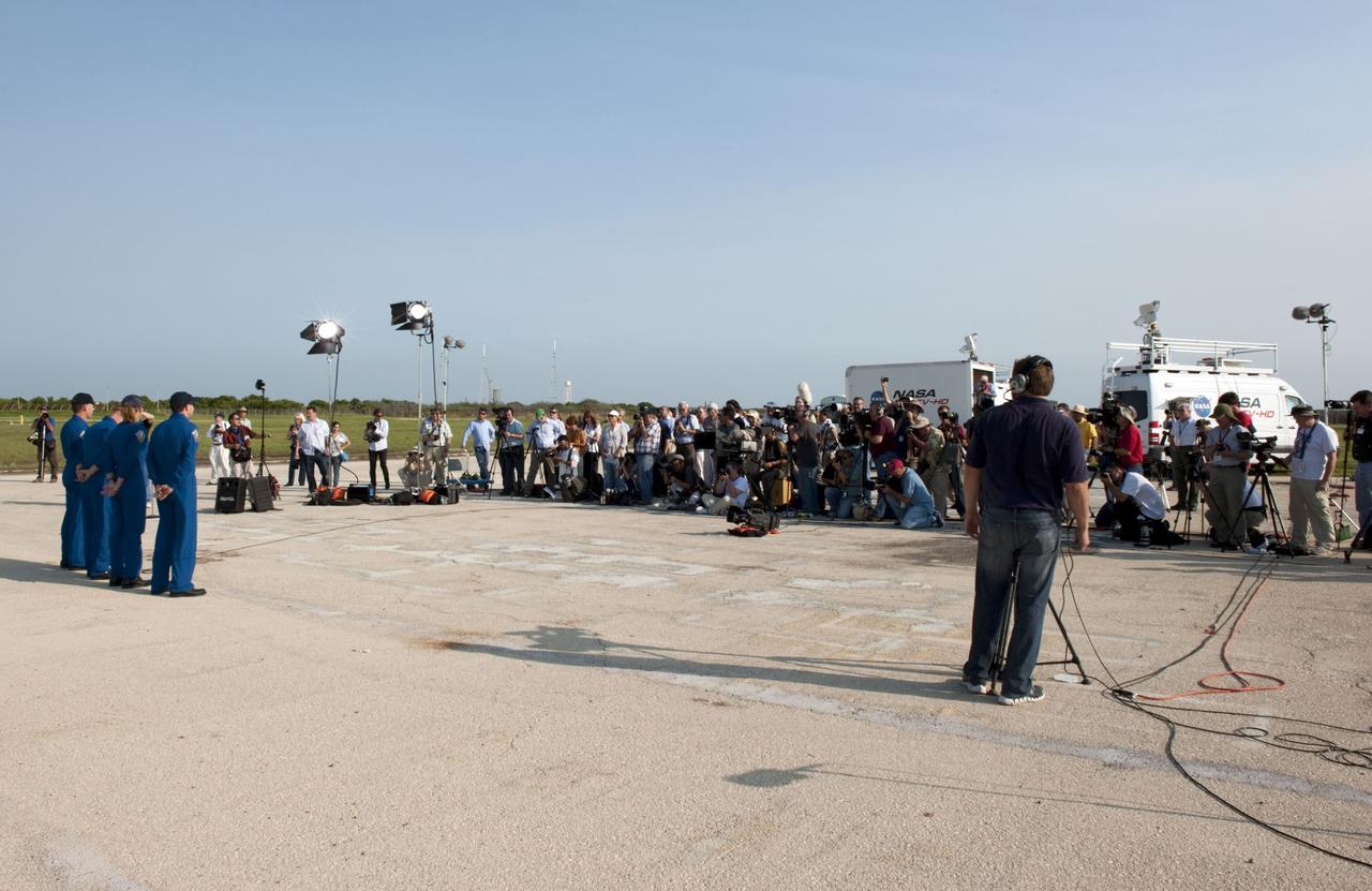 CAPE CANAVERAL, Fla. -- The STS-135 crew members gather at NASA Kennedy Space Center's Launch Pad 39A in Florida for a question-and-answer session with media. Space shuttle Atlantis' astronauts are at Kennedy to participate in a launch countdown dress rehearsal called the Terminal Countdown Demonstration Test (TCDT) and related training.      Atlantis and its crew are targeted to lift off July 8, taking with them the Raffaello multi-purpose logistics module packed with supplies and spare parts to the International Space Station. The STS-135 mission also will fly a system to investigate the potential for robotically refueling existing satellites and return a failed ammonia pump module to help NASA better understand the failure mechanism and improve pump designs for future systems. STS-135 will be the 33rd flight of Atlantis, the 37th shuttle mission to the space station, and the 135th and final mission of NASA's Space Shuttle Program. For more information visit, www.nasa.gov/mission_pages/shuttle/shuttlemissions/sts135/index.html. Photo credit: NASA/Kim Shiflett