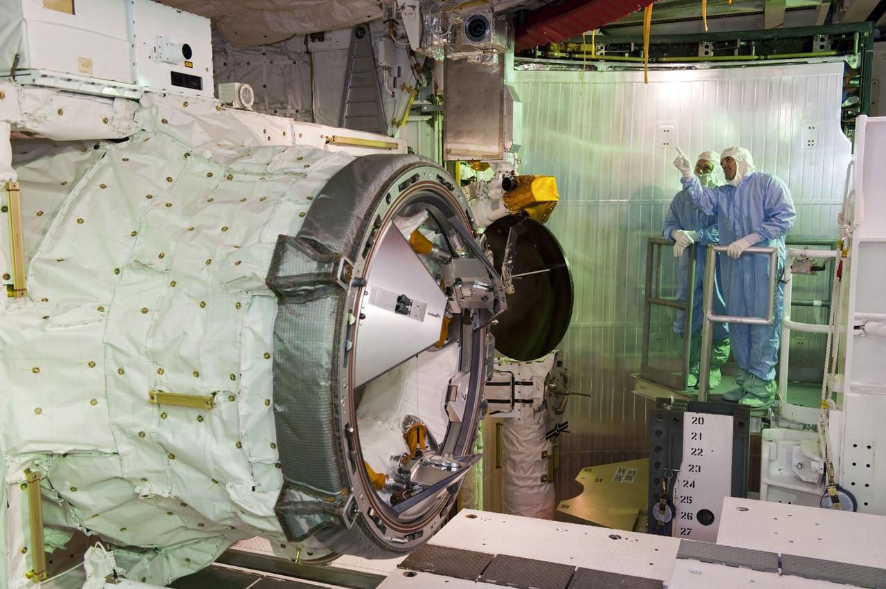 CAPE CANAVERAL, Fla. -- At Launch Pad 39A at NASA's Kennedy Space Center in Florida, space shuttle Atlantis' STS-135 crew members take part in a payload bay walkdown to check out the cargo secured in Atlantis' bay. Seen here inspecting the airlock are Pilot Doug Hurley (left) and Mission Specialist Rex Walheim.          The astronauts are at Kennedy to participate in a launch countdown dress rehearsal called the Terminal Countdown Demonstration Test (TCDT) and related training. Atlantis and its crew are targeted to lift off July 8, taking with them the Raffaello multi-purpose logistics module packed with supplies and spare parts to the International Space Station. The STS-135 mission also will fly a system to investigate the potential for robotically refueling existing satellites and return a failed ammonia pump module to help NASA better understand the failure mechanism and improve pump designs for future systems. STS-135 will be the 33rd flight of Atlantis, the 37th shuttle mission to the space station, and the 135th and final mission of NASA's Space Shuttle Program. For more information visit, www.nasa.gov/mission_pages/shuttle/shuttlemissions/sts135/index.html. Photo credit: NASA/Kim Shiflett