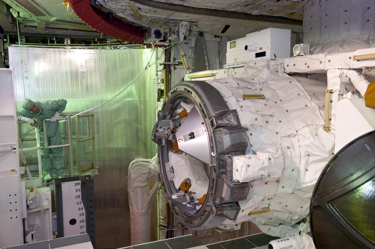 CAPE CANAVERAL, Fla. -- At Launch Pad 39A at NASA's Kennedy Space Center in Florida, space shuttle Atlantis' STS-135 crew members take part in a payload bay walkdown to check out the cargo secured in Atlantis' bay. Seen here inspecting the airlock is Commander Chris Ferguson.        The astronauts are at Kennedy to participate in a launch countdown dress rehearsal called the Terminal Countdown Demonstration Test (TCDT) and related training. Atlantis and its crew are targeted to lift off July 8, taking with them the Raffaello multi-purpose logistics module packed with supplies and spare parts to the International Space Station. The STS-135 mission also will fly a system to investigate the potential for robotically refueling existing satellites and return a failed ammonia pump module to help NASA better understand the failure mechanism and improve pump designs for future systems. STS-135 will be the 33rd flight of Atlantis, the 37th shuttle mission to the space station, and the 135th and final mission of NASA's Space Shuttle Program. For more information visit, www.nasa.gov/mission_pages/shuttle/shuttlemissions/sts135/index.html. Photo credit: NASA/Kim Shiflett