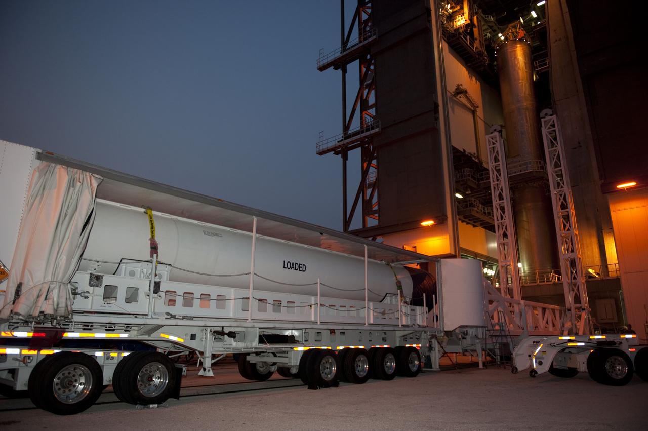 CAPE CANAVERAL, Fla. -- At Cape Canaveral Air Force Station in Florida, workers deliver a solid rocket motor to the Vertical Integration Facility at Launch Complex 41. It then will be lifted into position and attached to the United Launch Alliance Atlas V booster stage, already at the pad. NASA's Juno spacecraft is scheduled to launch aboard an Atlas V from Cape Canaveral, Fla. Aug. 5.The solar-powered spacecraft will orbit Jupiter's poles 33 times to find out more about the gas giant's origins, structure, atmosphere and magnetosphere and investigate the existence of a solid planetary core. For more information visit: www.nasa.gov/juno. Photo credit: NASA/Kim Shiflett