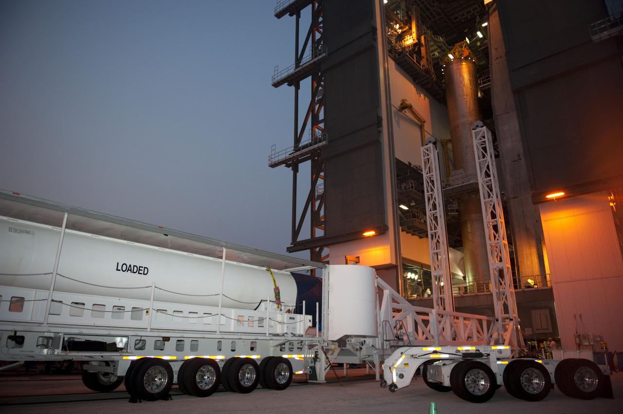 CAPE CANAVERAL, Fla. -- At Cape Canaveral Air Force Station in Florida, workers deliver a solid rocket motor to the Vertical Integration Facility at Launch Complex 41. It then will be lifted into position and attached to the United Launch Alliance Atlas V booster stage, already at the pad. NASA's Juno spacecraft is scheduled to launch aboard an Atlas V from Cape Canaveral, Fla. Aug. 5.The solar-powered spacecraft will orbit Jupiter's poles 33 times to find out more about the gas giant's origins, structure, atmosphere and magnetosphere and investigate the existence of a solid planetary core. For more information visit: www.nasa.gov/juno. Photo credit: NASA/Kim Shiflett