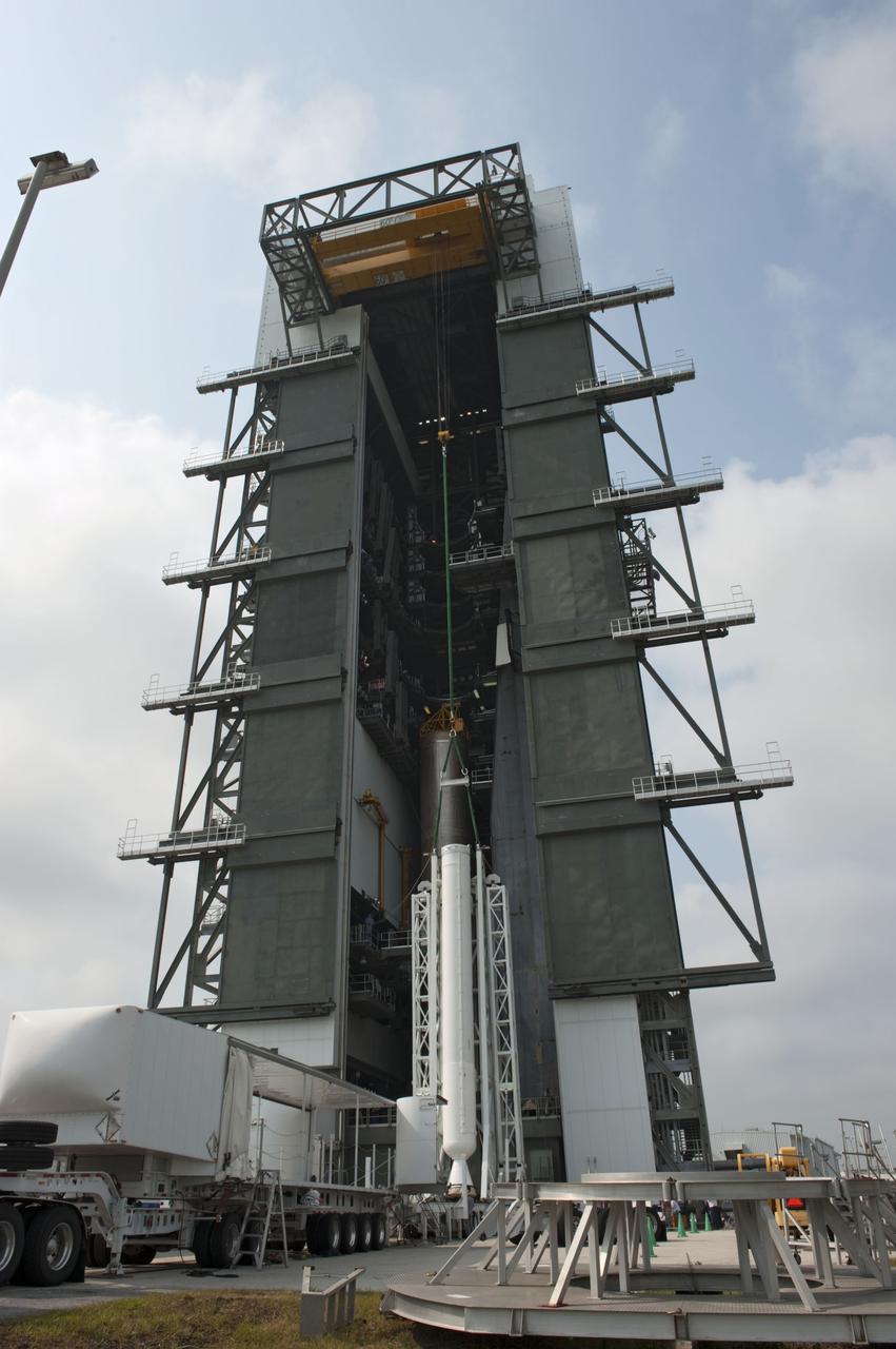 CAPE CANAVERAL, Fla. -- At Cape Canaveral Air Force Station in Florida, workers using an overhead crane lift a solid rocket motor into the Vertical Integration Facility at Launch Complex 41. It then will be attached to the United Launch Alliance Atlas V booster stage, already at the pad. NASA's Juno spacecraft is scheduled to launch aboard an Atlas V from Cape Canaveral, Fla. Aug. 5.The solar-powered spacecraft will orbit Jupiter's poles 33 times to find out more about the gas giant's origins, structure, atmosphere and magnetosphere and investigate the existence of a solid planetary core. For more information visit: www.nasa.gov/juno. Photo credit: NASA/Kim Shiflett