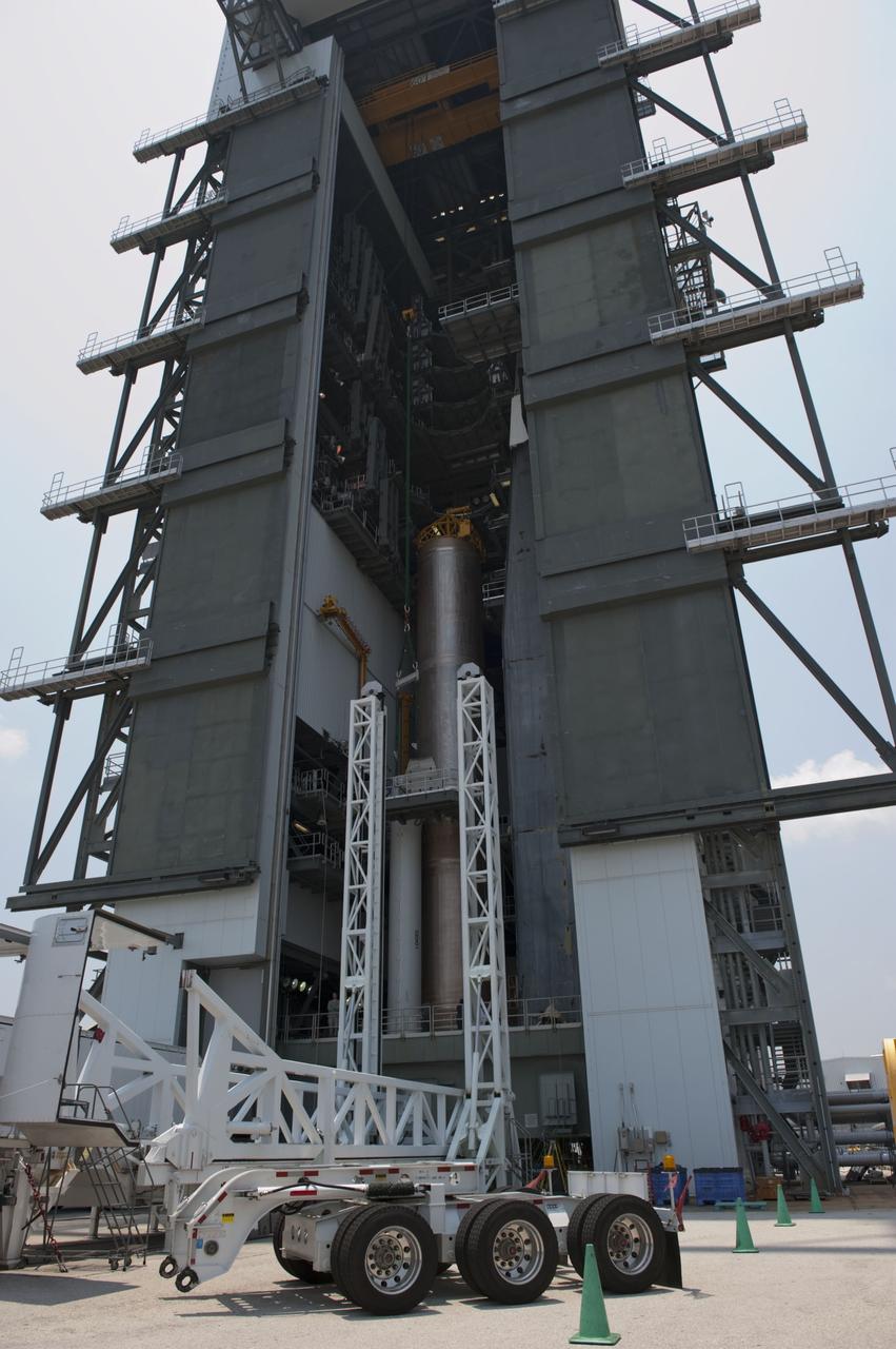 CAPE CANAVERAL, Fla. -- At Cape Canaveral Air Force Station in Florida, a solid rocket motor now is in position to be attached to the United Launch Alliance Atlas V booster stage already in the Vertical Integration Facility at Launch complex 41. NASA's Juno spacecraft is scheduled to launch aboard an Atlas V from Cape Canaveral, Fla. Aug. 5.The solar-powered spacecraft will orbit Jupiter's poles 33 times to find out more about the gas giant's origins, structure, atmosphere and magnetosphere and investigate the existence of a solid planetary core. For more information visit: www.nasa.gov/juno. Photo credit: NASA/Kim Shiflett