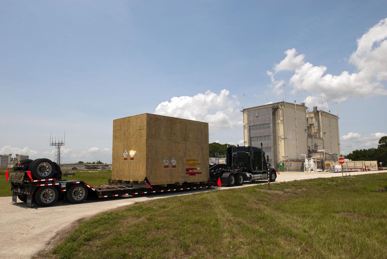 CAPE CANAVERAL, Fla. - Space shuttle Discovery's orbital maneuvering system pods and forward reaction control system have been loaded into a container and are being transported from NASA's Kennedy Space Center in Florida to White Sands Space Harbor in New Mexico. There, they will undergo a complete deservicing and cleaning. The removal is part of Discovery's transition and retirement processing. Shuttle Discovery will go to the Smithsonian's National Air and Space Museum, Steven F. Udvar-Hazy Center in Chantilly, Va., Endeavour will go to the California Science Center in Los Angeles and Enterprise will be moved from the Smithsonian to the Intrepid Sea, Air and Space Museum in New York. Shuttle Atlantis will go to the Kennedy Space Center Visitor Complex. Photo credit: NASA/Jim Grossmann