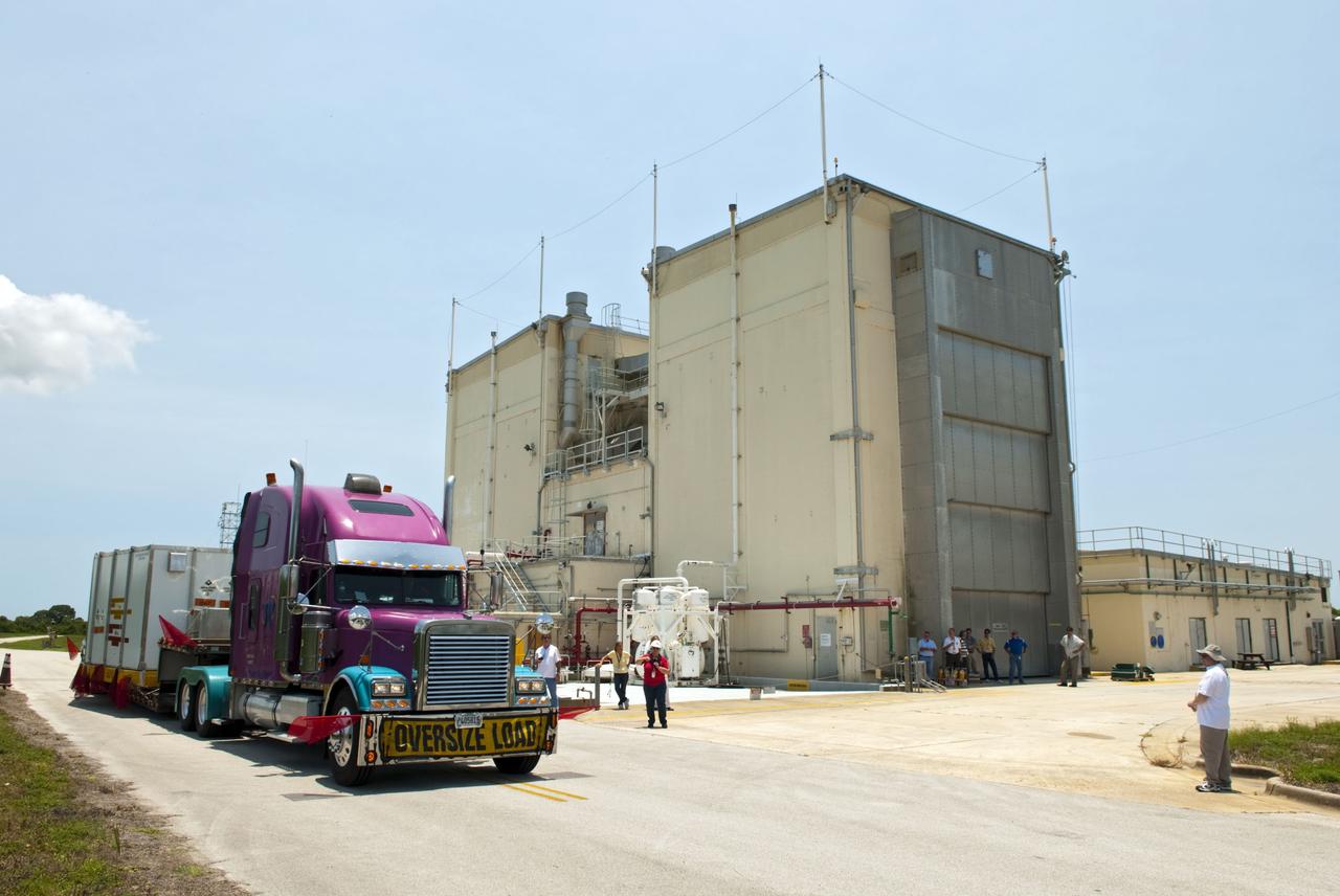 CAPE CANAVERAL, Fla. - Space shuttle Discovery's orbital maneuvering system pods and forward reaction control system have been loaded into a container and are being transported from NASA's Kennedy Space Center in Florida to White Sands Space Harbor in New Mexico. There, they will undergo a complete deservicing and cleaning. The removal is part of Discovery's transition and retirement processing. Shuttle Discovery will go to the Smithsonian's National Air and Space Museum, Steven F. Udvar-Hazy Center in Chantilly, Va., Endeavour will go to the California Science Center in Los Angeles and Enterprise will be moved from the Smithsonian to the Intrepid Sea, Air and Space Museum in New York. Shuttle Atlantis will go to the Kennedy Space Center Visitor Complex. Photo credit: NASA/Jim Grossmann