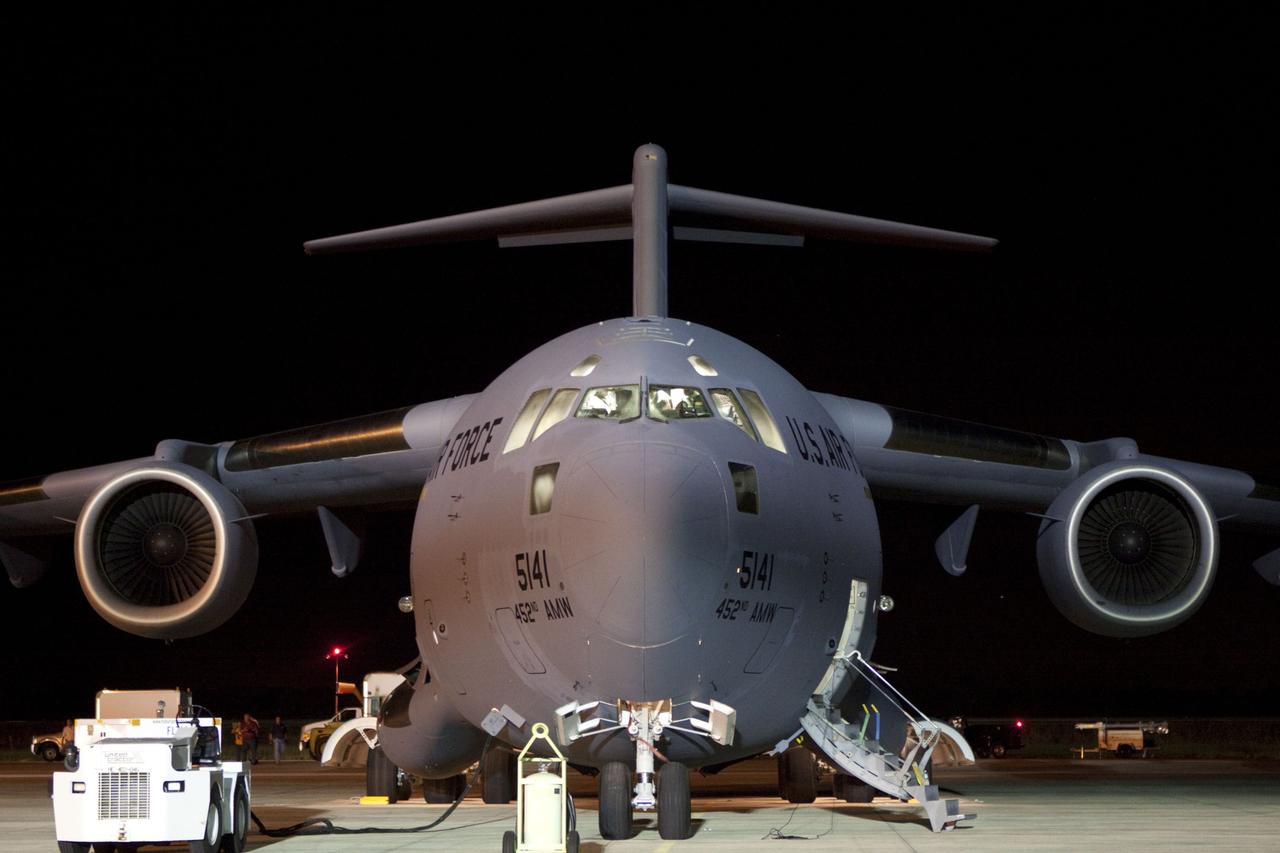 Cape Canaveral, Fla. -- NASA's Mars Science Laboratory (MSL) rover, known as Curiosity, arrives at the Shuttle Landing Facility at NASA's Kennedy Space Center in Florida aboard an Air Force C-17 cargo plane. Also aboard is the rocket-powered descent stage that will fly the rover during the final moments before landing on Mars. A United Launch Alliance Atlas V-541 configuration will be used to loft MSL into space. Curiosity’s 10 science instruments are designed to search for evidence on whether Mars has had environments favorable to microbial life, including chemical ingredients for life. The unique rover will use a laser to look inside rocks and release its gasses so that the rover’s spectrometer can analyze and send the data back to Earth. MSL is scheduled to launch from Cape Canaveral Air Force Station in Florida Nov. 25 with a window extending to Dec. 18 and arrival at Mars Aug. 2012. For more information, visit http://www.nasa.gov/msl. Photo credit: NASA/Troy Cryder