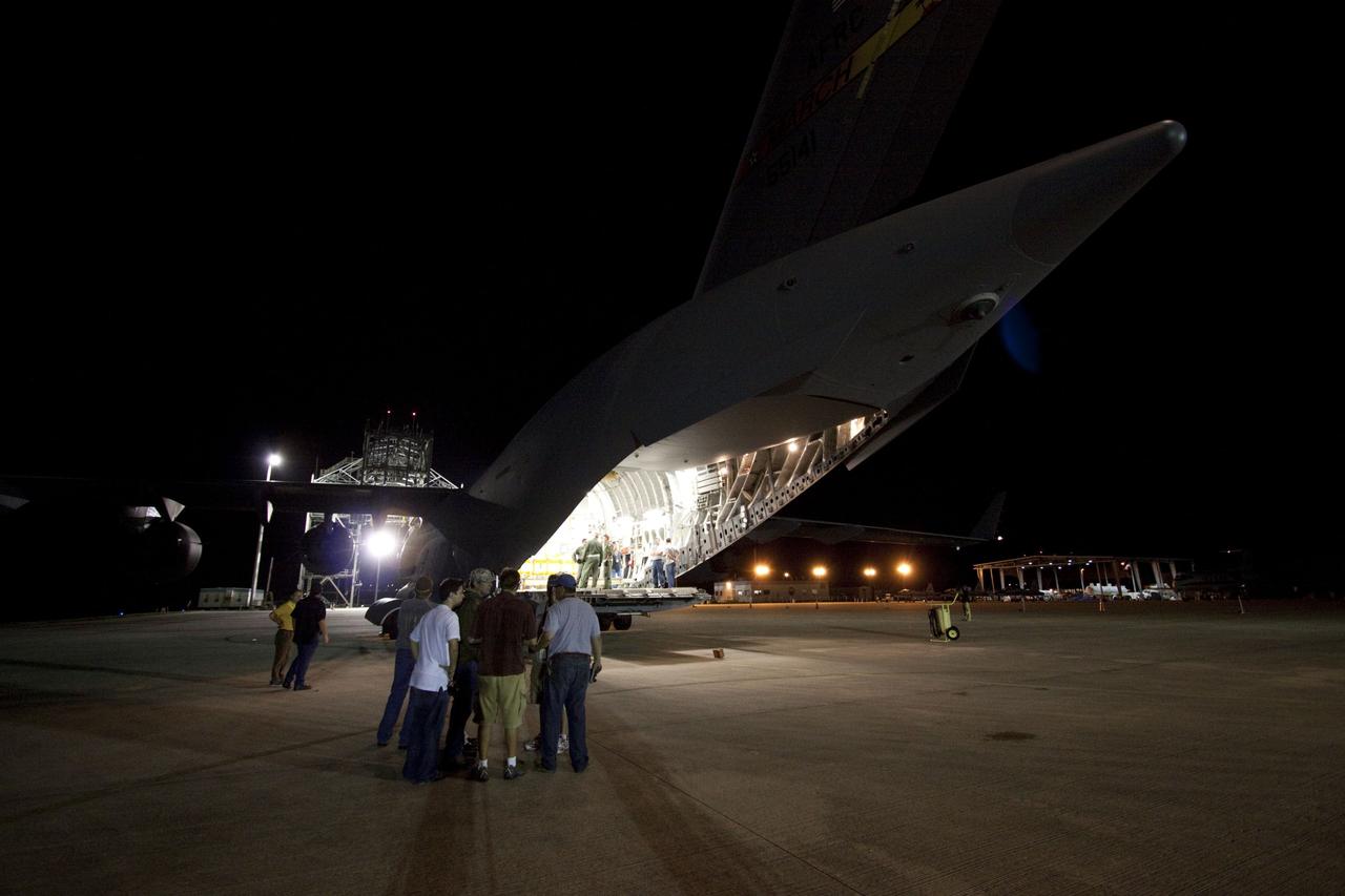 Cape Canaveral, Fla. -- Workers prepare to unload NASA's Mars Science Laboratory (MSL) rocket-powered descent stage that will fly the rover during the final moments before landing on Mars. It arrived at the Shuttle Landing Facility at NASA's Kennedy Space Center in Florida aboard an Air Force C-17 cargo plane along with the MSL rover known as Curiosity. A United Launch Alliance Atlas V-541 configuration will be used to loft MSL into space. Curiosity’s 10 science instruments are designed to search for evidence on whether Mars has had environments favorable to microbial life, including chemical ingredients for life. The unique rover will use a laser to look inside rocks and release its gasses so that the rover’s spectrometer can analyze and send the data back to Earth. MSL is scheduled to launch from Cape Canaveral Air Force Station in Florida Nov. 25 with a window extending to Dec. 18 and arrival at Mars Aug. 2012. For more information, visit http://www.nasa.gov/msl. Photo credit: NASA/Troy Cryder