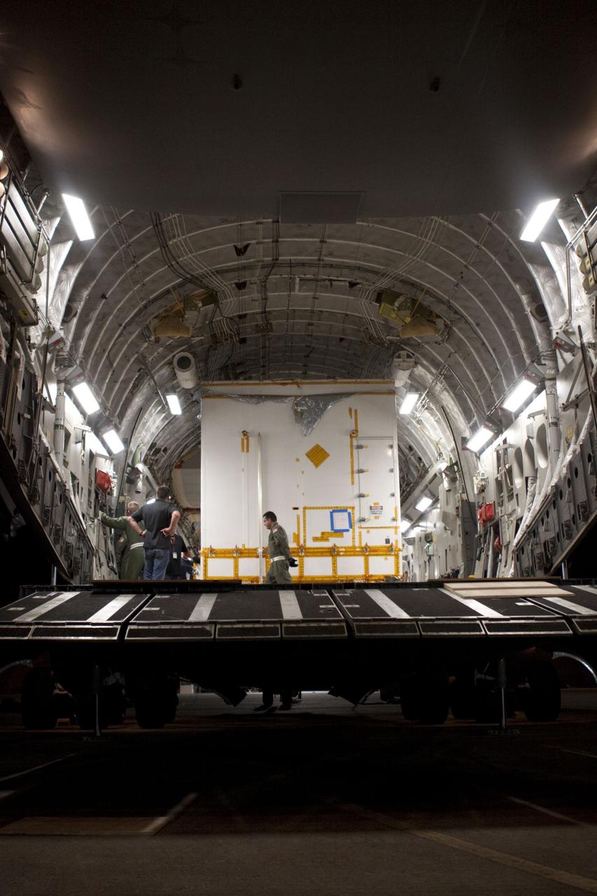 CAPE CANAVERAL, Fla. -- Workers begin to unload NASA's Mars Science Laboratory (MSL) rocket-powered descent stage that will fly the rover during the final moments before landing on Mars. It arrived at the Shuttle Landing Facility at NASA's Kennedy Space Center in Florida aboard an Air Force C-17 cargo plane along with the MSL rover known as Curiosity. A United Launch Alliance Atlas V-541 configuration will be used to loft MSL into space. Curiosity’s 10 science instruments are designed to search for evidence on whether Mars has had environments favorable to microbial life, including chemical ingredients for life. The unique rover will use a laser to look inside rocks and release its gasses so that the rover’s spectrometer can analyze and send the data back to Earth. MSL is scheduled to launch from Cape Canaveral Air Force Station in Florida Nov. 25 with a window extending to Dec. 18 and arrival at Mars Aug. 2012. For more information, visit http://www.nasa.gov/msl. Photo credit: NASA/Troy Cryder