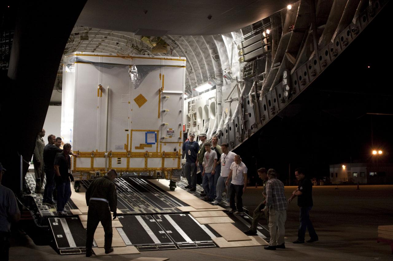 CAPE CANAVERAL, Fla. -- Workers unload NASA's Mars Science Laboratory (MSL) rocket-powered descent stage that will fly the rover during the final moments before landing on Mars. It arrived at the Shuttle Landing Facility at NASA's Kennedy Space Center in Florida aboard an Air Force C-17 cargo plane along with the MSL rover known as Curiosity. A United Launch Alliance Atlas V-541 configuration will be used to loft MSL into space. Curiosity’s 10 science instruments are designed to search for evidence on whether Mars has had environments favorable to microbial life, including chemical ingredients for life. The unique rover will use a laser to look inside rocks and release its gasses so that the rover’s spectrometer can analyze and send the data back to Earth. MSL is scheduled to launch from Cape Canaveral Air Force Station in Florida Nov. 25 with a window extending to Dec. 18 and arrival at Mars Aug. 2012. For more information, visit http://www.nasa.gov/msl. Photo credit: NASA/Troy Cryder