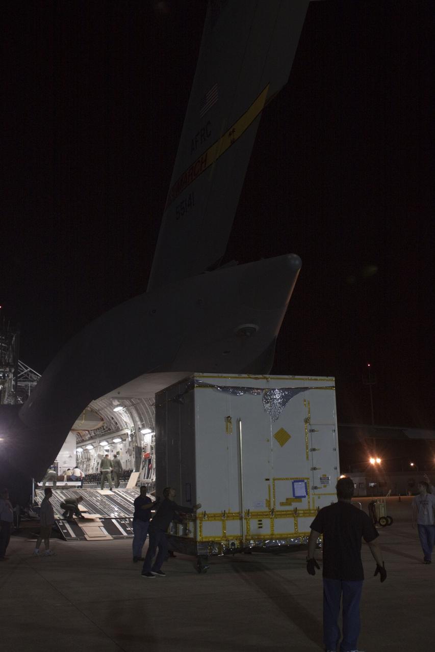 CAPE CANAVERAL, Fla. -- Workers unload NASA's Mars Science Laboratory (MSL) rocket-powered descent stage that will fly the rover during the final moments before landing on Mars. It arrived at the Shuttle Landing Facility at NASA's Kennedy Space Center in Florida aboard an Air Force C-17 cargo plane along with the MSL rover known as Curiosity. A United Launch Alliance Atlas V-541 configuration will be used to loft MSL into space. Curiosity’s 10 science instruments are designed to search for evidence on whether Mars has had environments favorable to microbial life, including chemical ingredients for life. The unique rover will use a laser to look inside rocks and release its gasses so that the rover’s spectrometer can analyze and send the data back to Earth. MSL is scheduled to launch from Cape Canaveral Air Force Station in Florida Nov. 25 with a window extending to Dec. 18 and arrival at Mars Aug. 2012. For more information, visit http://www.nasa.gov/msl. Photo credit: NASA/Troy Cryder