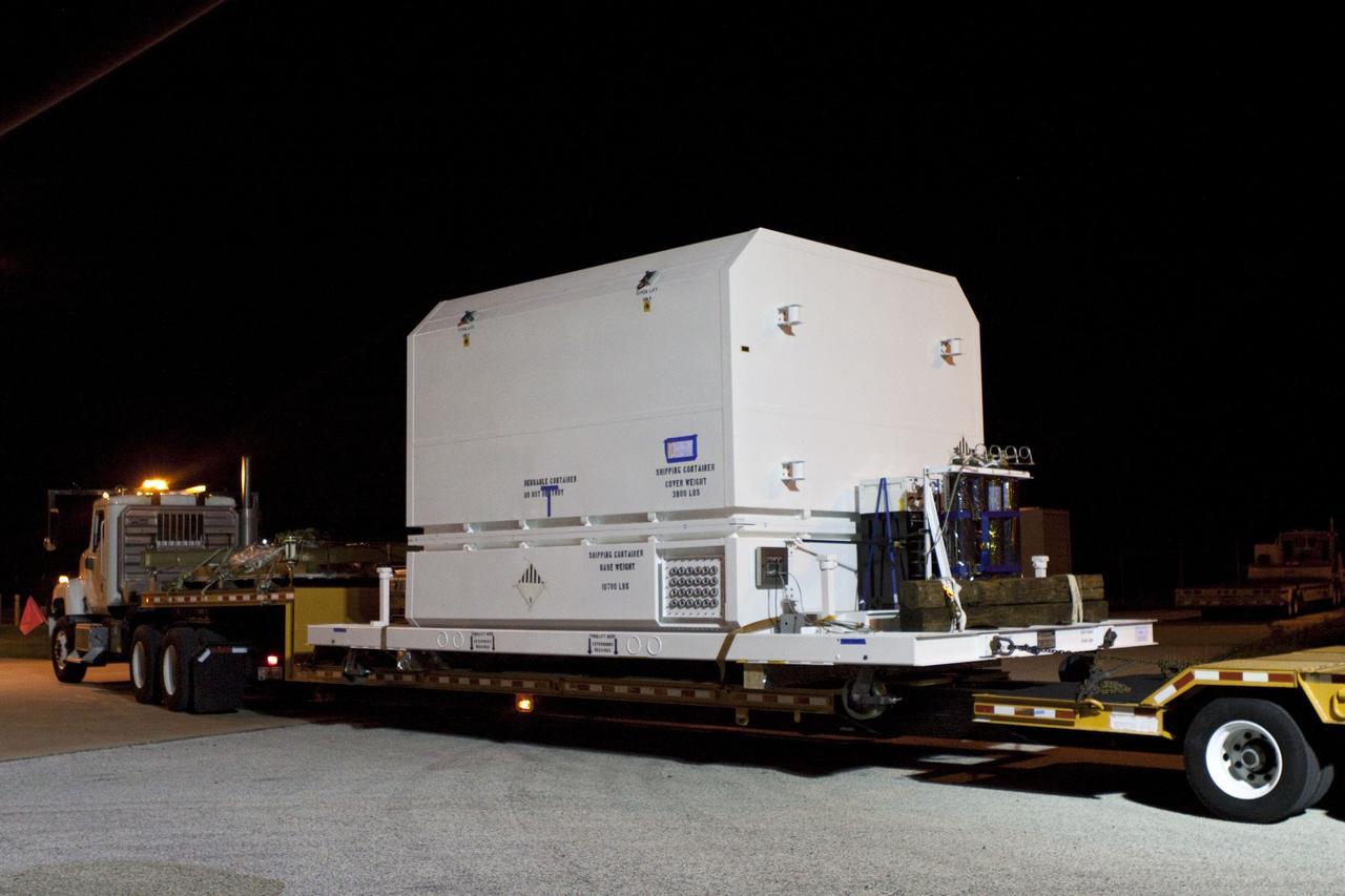 CAPE CANAVERAL, Fla. -- Workers transport a container holding NASA's Mars Science Laboratory (MSL) rover, known as Curiosity, to the Payload Hazardous Servicing Facility (PHSF) at NASA's Kennedy Space Center in Florida. Already delivered to the PHSF is the MSL rocket-powered descent stage that will fly the rover during the final moments before landing on Mars. A United Launch Alliance Atlas V-541 configuration will be used to loft MSL into space. Curiosity’s 10 science instruments are designed to search for evidence on whether Mars has had environments favorable to microbial life, including chemical ingredients for life. The unique rover will use a laser to look inside rocks and release its gasses so that the rover’s spectrometer can analyze and send the data back to Earth. MSL is scheduled to launch from Cape Canaveral Air Force Station in Florida Nov. 25 with a window extending to Dec. 18 and arrival at Mars Aug. 2012. For more information, visit http://www.nasa.gov/msl. Photo credit: NASA/Troy Cryder