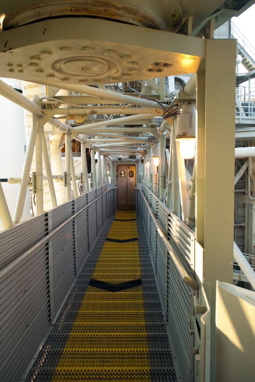 CAPE CANAVERAL, Fla. -- The doors to the White Room which provides entry to space shuttle Atlantis' crew compartment is seen here at the end of the access arm walkway on Launch Pad 39A at NASA's Kennedy Space Center in Florida. The STS-135 crew members will be at the pad to participate in a launch countdown simulation exercise.            As part of the Terminal Countdown Demonstration Test (TCDT), the crew members are strapped into their seats on Atlantis to practice the steps that will be taken on launch day. Shuttle Atlantis and its crew are targeted to lift off July 8, taking with them the Raffaello multi-purpose logistics module packed with supplies and spare parts to the International Space Station. The STS-135 mission also will fly a system to investigate the potential for robotically refueling existing satellites and return a failed ammonia pump module to help NASA better understand the failure mechanism and improve pump designs for future systems. STS-135 will be the 33rd flight of Atlantis, the 37th shuttle mission to the space station, and the 135th and final mission of NASA's Space Shuttle Program. For more information visit, www.nasa.gov/mission_pages/shuttle/shuttlemissions/sts135/index.html. Photo credit: NASA/Jim Grossmann
