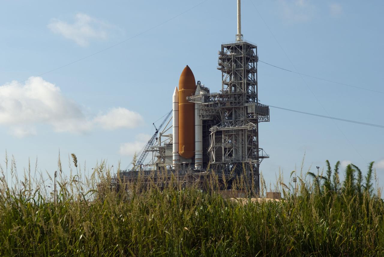 CAPE CANAVERAL, Fla. -- At Launch Pad 39A at NASA's Kennedy Space Center in Florida, space shuttle Atlantis stands majestically on its mobile launcher platform while the STS-135 crew members are at the pad to participate in a launch countdown simulation exercise.          As part of the Terminal Countdown Demonstration Test (TCDT), the crew members are strapped into their seats on Atlantis to practice the steps that will be taken on launch day. Shuttle Atlantis and its crew are targeted to lift off July 8, taking with them the Raffaello multi-purpose logistics module packed with supplies and spare parts to the International Space Station. The STS-135 mission also will fly a system to investigate the potential for robotically refueling existing satellites and return a failed ammonia pump module to help NASA better understand the failure mechanism and improve pump designs for future systems. STS-135 will be the 33rd flight of Atlantis, the 37th shuttle mission to the space station, and the 135th and final mission of NASA's Space Shuttle Program. For more information visit, www.nasa.gov/mission_pages/shuttle/shuttlemissions/sts135/index.html. Photo credit: NASA/Jim Grossmann