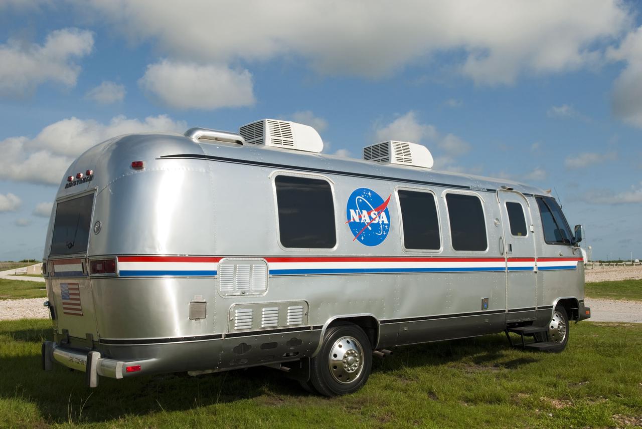 CAPE CANAVERAL, Fla. -- NASA's silver Astrovan is parked below Launch Pad 39A at NASA's Kennedy Space Center in Florida after delivering space shuttle Atlantis' STS-135 crew members to the pad to participate in a launch countdown simulation exercise. The Astrovan will return the astronauts to the Operations and Checkout Building at the end of their training.      As part of the Terminal Countdown Demonstration Test (TCDT), the crew members are strapped into their seats on Atlantis to practice the steps that will be taken on launch day. Shuttle Atlantis and its crew are targeted to lift off July 8, taking with them the Raffaello multi-purpose logistics module packed with supplies and spare parts to the International Space Station. The STS-135 mission also will fly a system to investigate the potential for robotically refueling existing satellites and return a failed ammonia pump module to help NASA better understand the failure mechanism and improve pump designs for future systems. STS-135 will be the 33rd flight of Atlantis, the 37th shuttle mission to the space station, and the 135th and final mission of NASA's Space Shuttle Program. For more information visit, www.nasa.gov/mission_pages/shuttle/shuttlemissions/sts135/index.html. Photo credit: NASA/Jim Grossmann