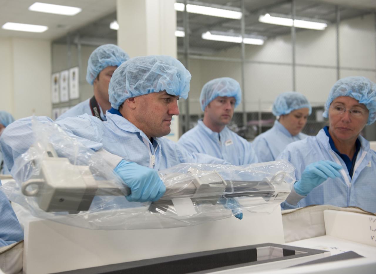 CAPE CANAVERAL, Fla. -- During the bench review of systems and hardware in the Space Station Processing Facility at NASA's Kennedy Space Center in Florida, space shuttle Atlantis' STS-135 crew members get a close look at some of the equipment they'll use in space. The astronauts dressed in clean-room attire, known as "bunny suits" are Mission Specialists Rex Walheim (left) and Sandy Magnus.              The review is part of the Terminal Countdown Demonstration Test (TCDT) and related training. Atlantis and its crew are targeted to lift off July 8, taking with them the Raffaello multi-purpose logistics module packed with supplies and spare parts to the International Space Station. The STS-135 mission also will fly a system to investigate the potential for robotically refueling existing satellites and return a failed ammonia pump module to help NASA better understand the failure mechanism and improve pump designs for future systems. STS-135 will be the 33rd flight of Atlantis, the 37th shuttle mission to the space station, and the 135th and final mission of NASA's Space Shuttle Program. For more information visit, www.nasa.gov/mission_pages/shuttle/shuttlemissions/sts135/index.html. Photo credit: NASA/Kim Shiflett
