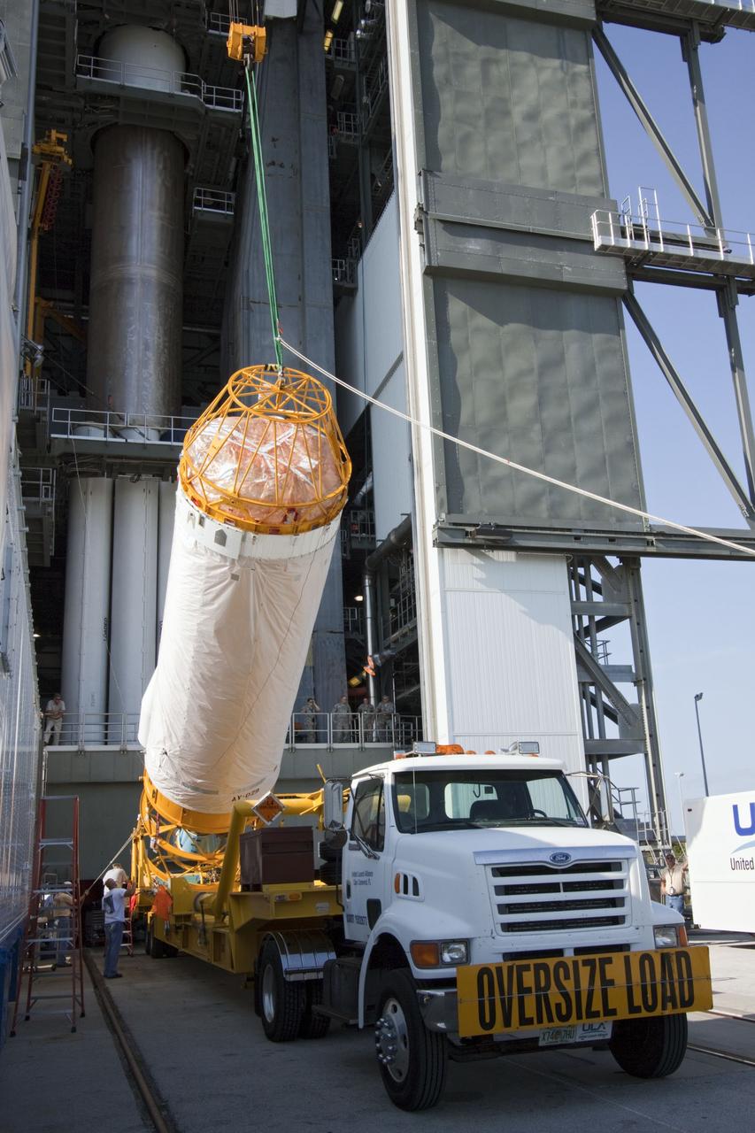 CAPE CANAVERAL, Fla. -- At Launch Complex 41 at Cape Canaveral Air Force Station in Florida, an overhead crane lifts the Centaur upper stage for the United Launch Alliance Atlas V, slated to launch NASA's Juno spacecraft, into the Vertical Integration Facility (VIF). After in position in the VIF it will be attached to the Atlas V booster stage, already at the pad.          Juno is scheduled to launch aboard an Atlas V from Cape Canaveral, Fla. Aug. 5.The solar-powered spacecraft will orbit Jupiter's poles 33 times to find out more about the gas giant's origins, structure, atmosphere and magnetosphere and investigate the existence of a solid planetary core. For more information visit: www.nasa.gov/juno. Photo credit: NASA/Jim Grossmann