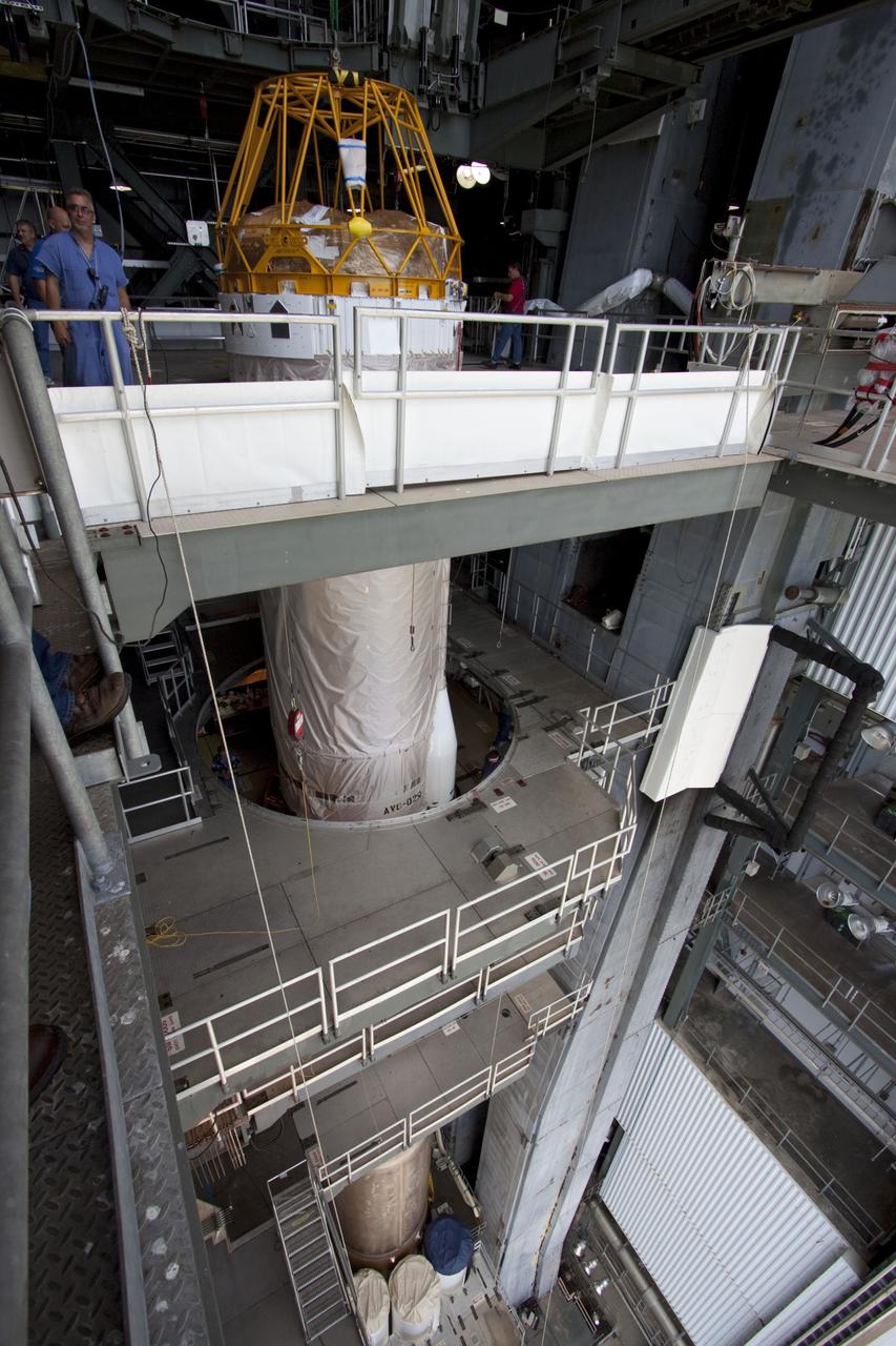 CAPE CANAVERAL, Fla. -- At Launch Complex 41 at Cape Canaveral Air Force Station in Florida, the Centaur upper stage for the United Launch Alliance Atlas V, slated to launch NASA's Juno spacecraft, is in position in the Vertical Integration Facility (VIF). It then will be attached to the Atlas V booster stage, already at the pad.        Juno is scheduled to launch aboard an Atlas V from Cape Canaveral, Fla. Aug. 5.The solar-powered spacecraft will orbit Jupiter's poles 33 times to find out more about the gas giant's origins, structure, atmosphere and magnetosphere and investigate the existence of a solid planetary core. For more information visit: www.nasa.gov/juno. Photo credit: NASA/Jim Grossmann