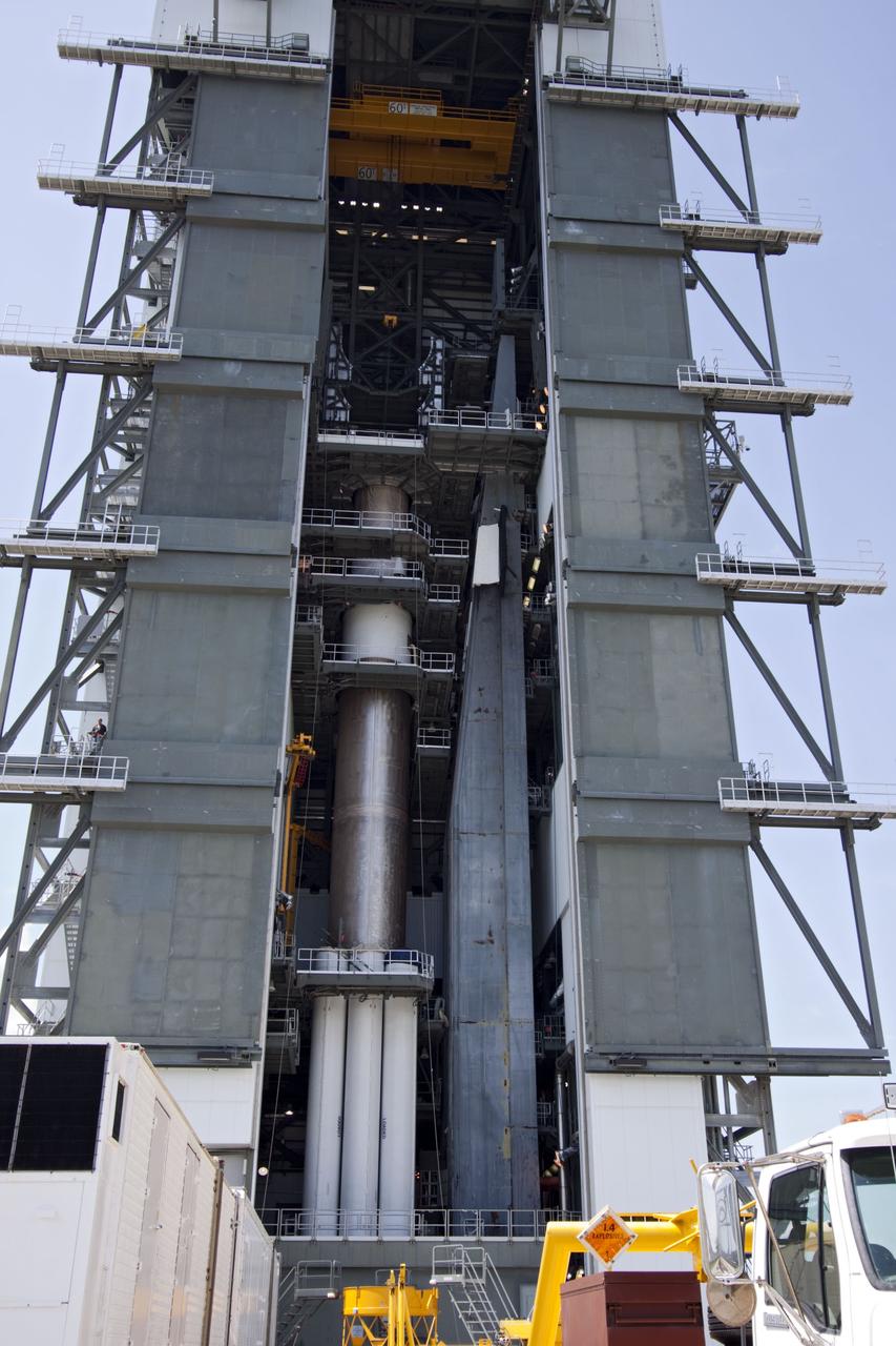 CAPE CANAVERAL, Fla. -- At Launch Complex 41 at Cape Canaveral Air Force Station in Florida, the Centaur upper stage for the United Launch Alliance Atlas V, slated to launch NASA's Juno spacecraft, is in position in the Vertical Integration Facility (VIF). It then will be attached to the Atlas V booster stage, already at the pad.      Juno is scheduled to launch aboard an Atlas V from Cape Canaveral, Fla. Aug. 5.The solar-powered spacecraft will orbit Jupiter's poles 33 times to find out more about the gas giant's origins, structure, atmosphere and magnetosphere and investigate the existence of a solid planetary core. For more information visit: www.nasa.gov/juno. Photo credit: NASA/Jim Grossmann