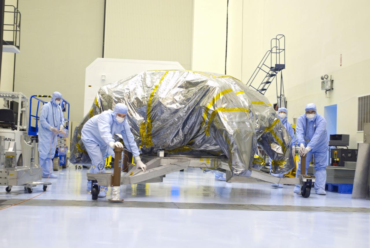 Cape Canaveral, Fla. -- At the Payload Hazardous Servicing Facility at NASA's Kennedy Space Center in Florida, technicians prepare to unwrap the rocket-powered descent stage for NASA's Mars Science Laboratory (MSL). The descent stage will fly the MSL rover, Curiosity, during the final moments before landing on Mars.            A United Launch Alliance Atlas V-541 configuration will be used to loft MSL into space. Curiosity’s 10 science instruments are designed to search for evidence on whether Mars has had environments favorable to microbial life, including chemical ingredients for life.  The unique rover will use a laser to look inside rocks and release its gasses so that the rover’s spectrometer can analyze and send the data back to Earth. MSL is scheduled to launch from Cape Canaveral Air Force Station in Florida Nov. 25 with a window extending to Dec. 18 and arrival at Mars Aug. 2012. For more information, visit http://www.nasa.gov/msl. Photo credit: NASA/Charisse Nahser