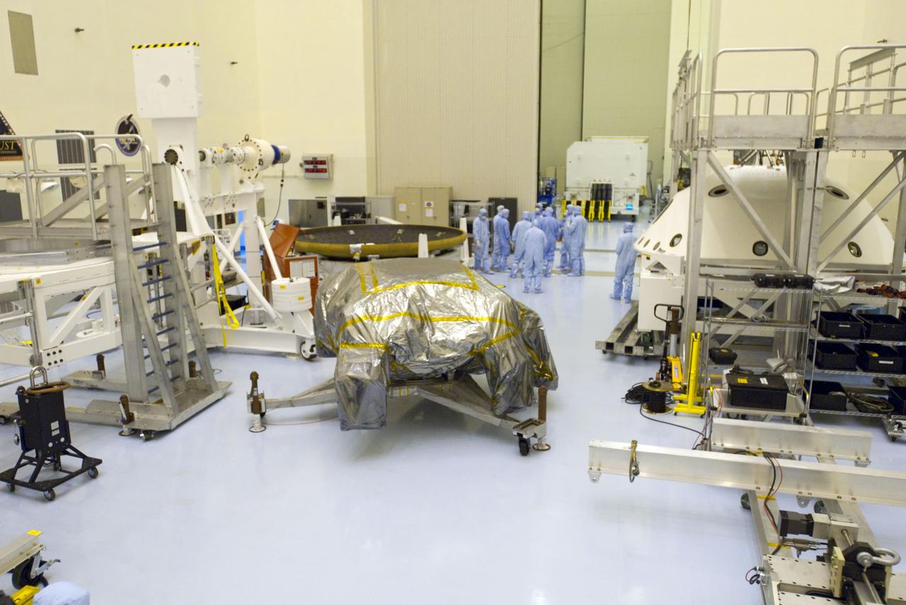 Cape Canaveral, Fla. -- At the Payload Hazardous Servicing Facility at NASA's Kennedy Space Center in Florida, technicians prepare to unwrap the rocket-powered descent stage for NASA's Mars Science Laboratory (MSL). The descent stage will fly the MSL rover, Curiosity, during the final moments before landing on Mars.            A United Launch Alliance Atlas V-541 configuration will be used to loft MSL into space. Curiosity’s 10 science instruments are designed to search for evidence on whether Mars has had environments favorable to microbial life, including chemical ingredients for life.  The unique rover will use a laser to look inside rocks and release its gasses so that the rover’s spectrometer can analyze and send the data back to Earth. MSL is scheduled to launch from Cape Canaveral Air Force Station in Florida Nov. 25 with a window extending to Dec. 18 and arrival at Mars Aug. 2012. For more information, visit http://www.nasa.gov/msl. Photo credit: NASA/Charisse Nahser