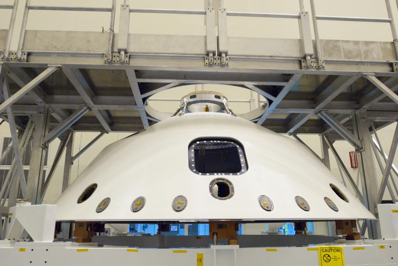 Cape Canaveral, Fla. -- At the Payload Hazardous Servicing Facility at NASA's Kennedy Space Center in Florida, technicians process the backshell for NASA's Mars Science Laboratory (MSL). The spacecraft's backshell, which carries the parachute and several components used during later stages of entry, descent and landing, when joined with the heat shield, is called an aeroshell. A United Launch Alliance Atlas V-541 configuration will be used to loft MSL into space. Curiosity’s 10 science instruments are designed to search for evidence on whether Mars has had environments favorable to microbial life, including chemical ingredients for life. The unique rover will use a laser to look inside rocks and release its gasses so that the rover’s spectrometer can analyze and send the data back to Earth. MSL is scheduled to launch from Cape Canaveral Air Force Station in Florida Nov. 25 with a window extending to Dec. 18 and arrival at Mars Aug. 2012. For more information, visit http://www.nasa.gov/msl. Photo credit: NASA/Charisse Nahser