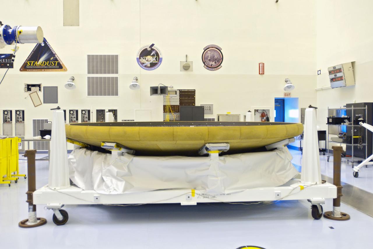 Cape Canaveral, Fla. -- At the Payload Hazardous Servicing Facility at NASA's Kennedy Space Center in Florida, technicians process the heat shield for NASA's Mars Science Laboratory (MSL). The spacecraft's heat shield, when joined with the backshell which carries the parachute and several components used during later stages of entry, descent and landing, is called an aeroshell. A United Launch Alliance Atlas V-541 configuration will be used to loft MSL into space. Curiosity’s 10 science instruments are designed to search for evidence on whether Mars has had environments favorable to microbial life, including chemical ingredients for life. The unique rover will use a laser to look inside rocks and release its gasses so that the rover’s spectrometer can analyze and send the data back to Earth. MSL is scheduled to launch from Cape Canaveral Air Force Station in Florida Nov. 25 with a window extending to Dec. 18 and arrival at Mars Aug. 2012. For more information, visit http://www.nasa.gov/msl. Photo credit: NASA/Charisse Nahser