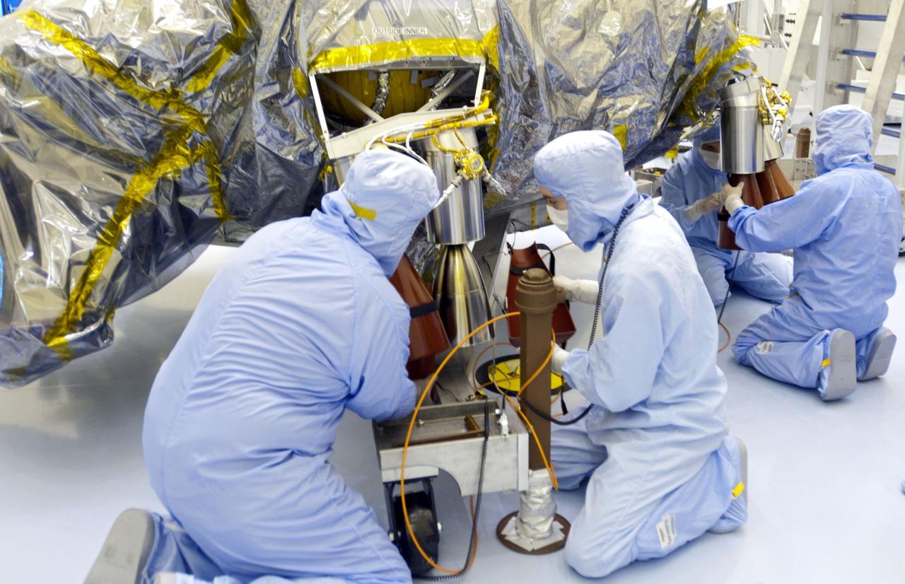 Cape Canaveral, Fla. -- At the Payload Hazardous Servicing Facility at NASA's Kennedy Space Center in Florida, technicians have unwrapped the protective cover from NASA's Mars Science Laboratory (MSL) rocket-powered descent stage thrusters for documenting and inspection. The descent stage will fly the MSL rover, Curiosity, during the final moments before landing on Mars.          A United Launch Alliance Atlas V-541 configuration will be used to loft MSL into space. Curiosity’s 10 science instruments are designed to search for evidence on whether Mars has had environments favorable to microbial life, including chemical ingredients for life.  The unique rover will use a laser to look inside rocks and release its gasses so that the rover’s spectrometer can analyze and send the data back to Earth. MSL is scheduled to launch from Cape Canaveral Air Force Station in Florida Nov. 25 with a window extending to Dec. 18 and arrival at Mars Aug. 2012. For more information, visit http://www.nasa.gov/msl. Photo credit: NASA/Charisse Nahser