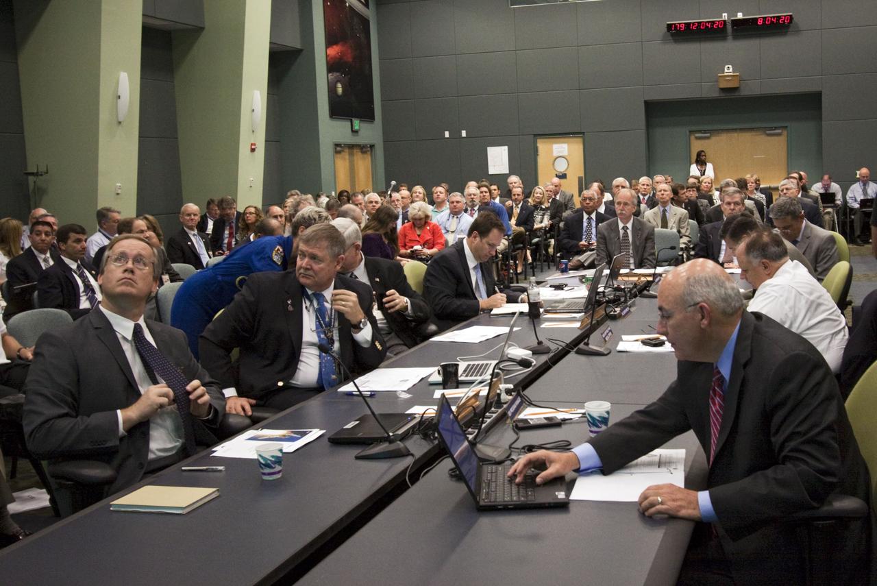 CAPE CANAVERAL, Fla. -- In the Operations Support Building II at NASA's Kennedy Space Center in Florida, Space Shuttle Program and mission managers meet for the traditional Flight Readiness Review, a thorough assessment of preparations for the mission. Seen here are Space Shuttle Program Manager John Shannon (left) and International Space Station Program Manager Michael Suffredini (right). The June 28 meeting is designed to produce a number of key decisions about Atlantis' STS-135 mission, including the announcement of an official launch date. Atlantis and its crew are targeted to lift off July 8, taking with them the Raffaello multi-purpose logistics module packed with supplies and spare parts to the International Space Station. The STS-135 mission also will fly a system to investigate the potential for robotically refueling existing satellites and return a failed ammonia pump module to help NASA better understand the failure mechanism and improve pump designs for future systems. STS-135 will be the 33rd flight of Atlantis, the 37th shuttle mission to the space station, and the 135th and final mission of NASA's Space Shuttle Program. For more information visit, www.nasa.gov/mission_pages/shuttle/shuttlemissions/sts135/index.html. Photo credit: Jim Grossmann