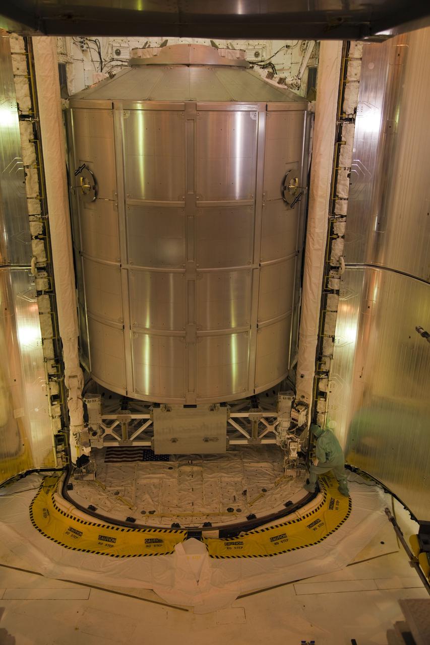 CAPE CANAVERAL, Fla. -- At Launch Pad 39A at NASA's Kennedy Space Center in Florida, work is under way to close space shuttle Atlantis' payload bay doors around the Raffaello multi-purpose logistics module (MPLM) payload for Atlantis' STS-135 mission to the International Space Station.        Commander Chris Ferguson, Pilot Doug Hurley and Mission Specialists Sandra Magnus and Rex Walheim are slated to lift off on July 8, taking with them the MPLM packed with supplies and spare parts to the station. The STS-135 mission also will fly a system to investigate the potential for robotically refueling existing satellites and return a failed ammonia pump module to help NASA better understand the failure mechanism and improve pump designs for future systems. STS-135 will be the 33rd flight of Atlantis, the 37th shuttle mission to the space station, and the 135th and final mission of NASA's Space Shuttle Program. For more information visit, www.nasa.gov/mission_pages/shuttle/shuttlemissions/sts135/index.html. Photo credit: NASA/Frank Michaux