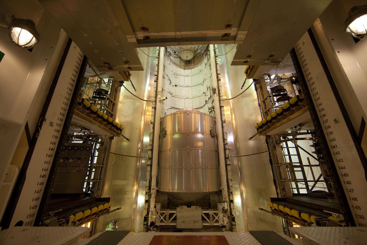 CAPE CANAVERAL, Fla. -- At Launch Pad 39A at NASA's Kennedy Space Center in Florida, work is under way to close space shuttle Atlantis' payload bay doors around the Raffaello multi-purpose logistics module (MPLM) payload for Atlantis' STS-135 mission to the International Space Station.        Commander Chris Ferguson, Pilot Doug Hurley and Mission Specialists Sandra Magnus and Rex Walheim are slated to lift off on July 8, taking with them the MPLM packed with supplies and spare parts to the station. The STS-135 mission also will fly a system to investigate the potential for robotically refueling existing satellites and return a failed ammonia pump module to help NASA better understand the failure mechanism and improve pump designs for future systems. STS-135 will be the 33rd flight of Atlantis, the 37th shuttle mission to the space station, and the 135th and final mission of NASA's Space Shuttle Program. For more information visit, www.nasa.gov/mission_pages/shuttle/shuttlemissions/sts135/index.html. Photo credit: NASA/Frank Michaux