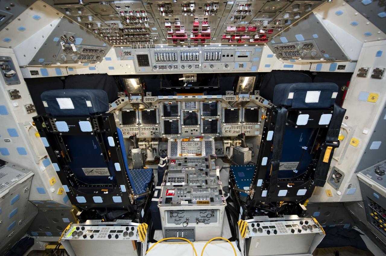 CAPE CANAVERAL, Fla. -- In Orbiter Processing Facility-1 at NASA's Kennedy Space Center in Florida, workers are disconnecting and dismantling components on shuttle Endeavour's cockpit. The work is part of Endeavour's transition and retirement processing. The spacecraft is being prepared for public display at the California Science Center in Los Angeles. Endeavour flew 25 missions, spent 299 days in space, orbited Earth 4,671 times and traveled 122,883,151 miles over the course of its 19-year career. Endeavour's STS-134 and final mission was completed after landing on June 1, 2011. Photo credit: NASA/Kim Shiflett